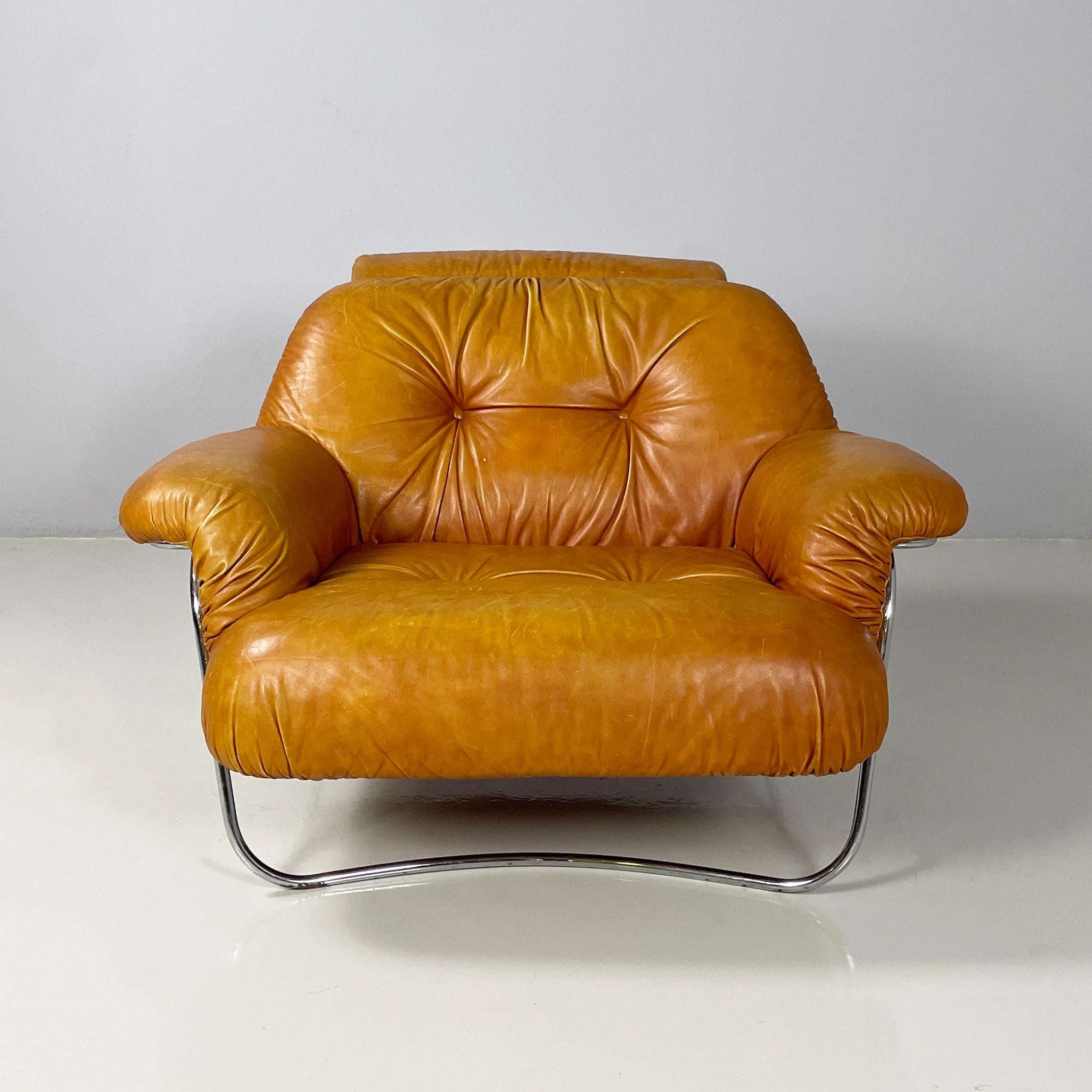 Italian modern Armchair in brown leather and chromed metal, 1970s
Vintage armchair with seat, armrests and backrest entirely padded and covered in brown leather. On the squared seat and backrest with rounded corners there are round buttons covered