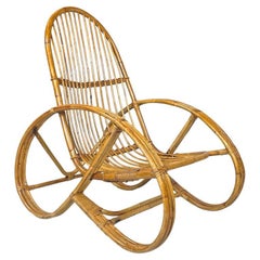 Italian modern armchair in rattan with rounded armrests and structure, 1970s