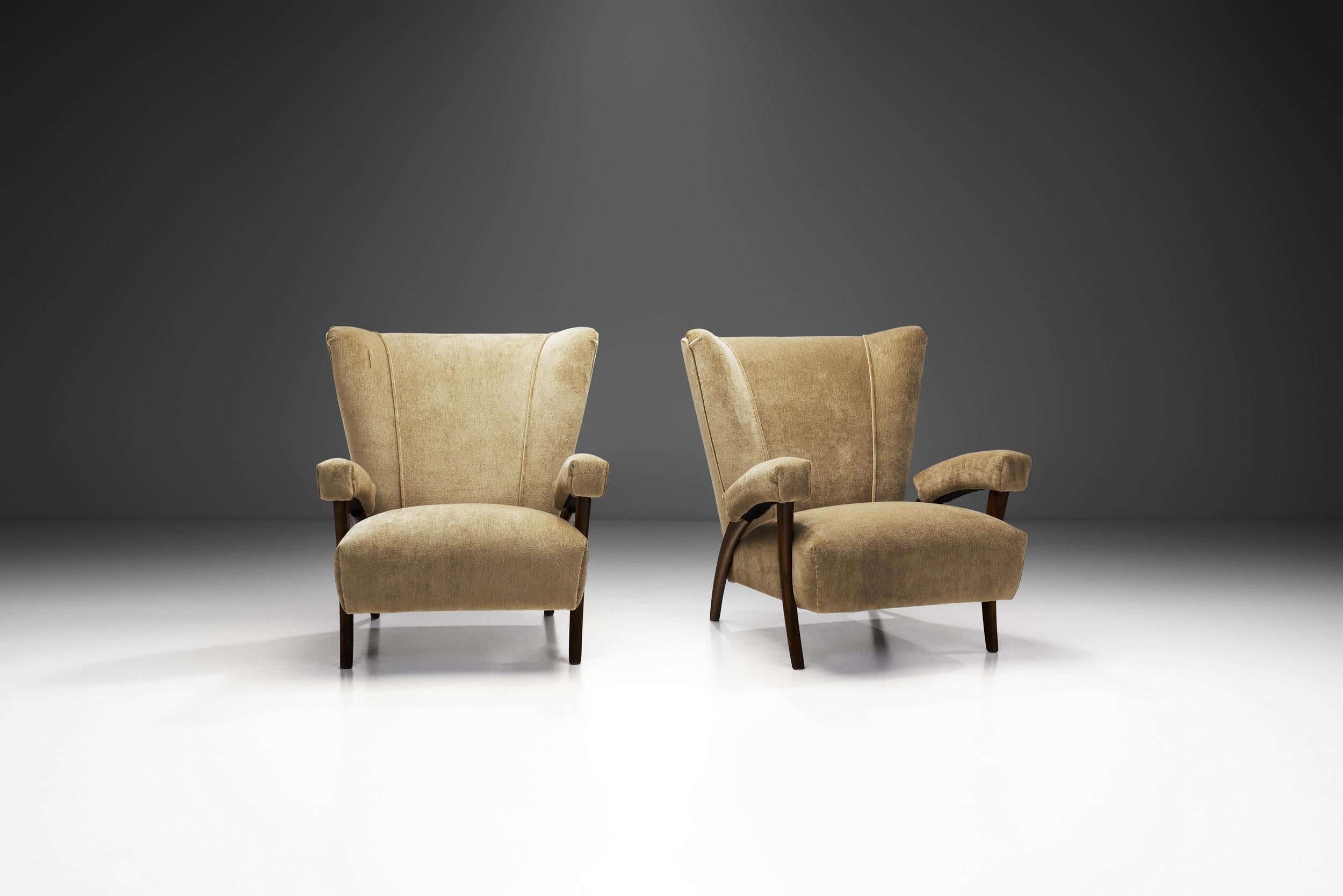 Italian Modern furniture is defined by unique design, perfect execution, and exclusivity. This pair of architectural armchairs is generally attributed to Italian design icon, Paolo Buffa. His design language was always coherent with current times