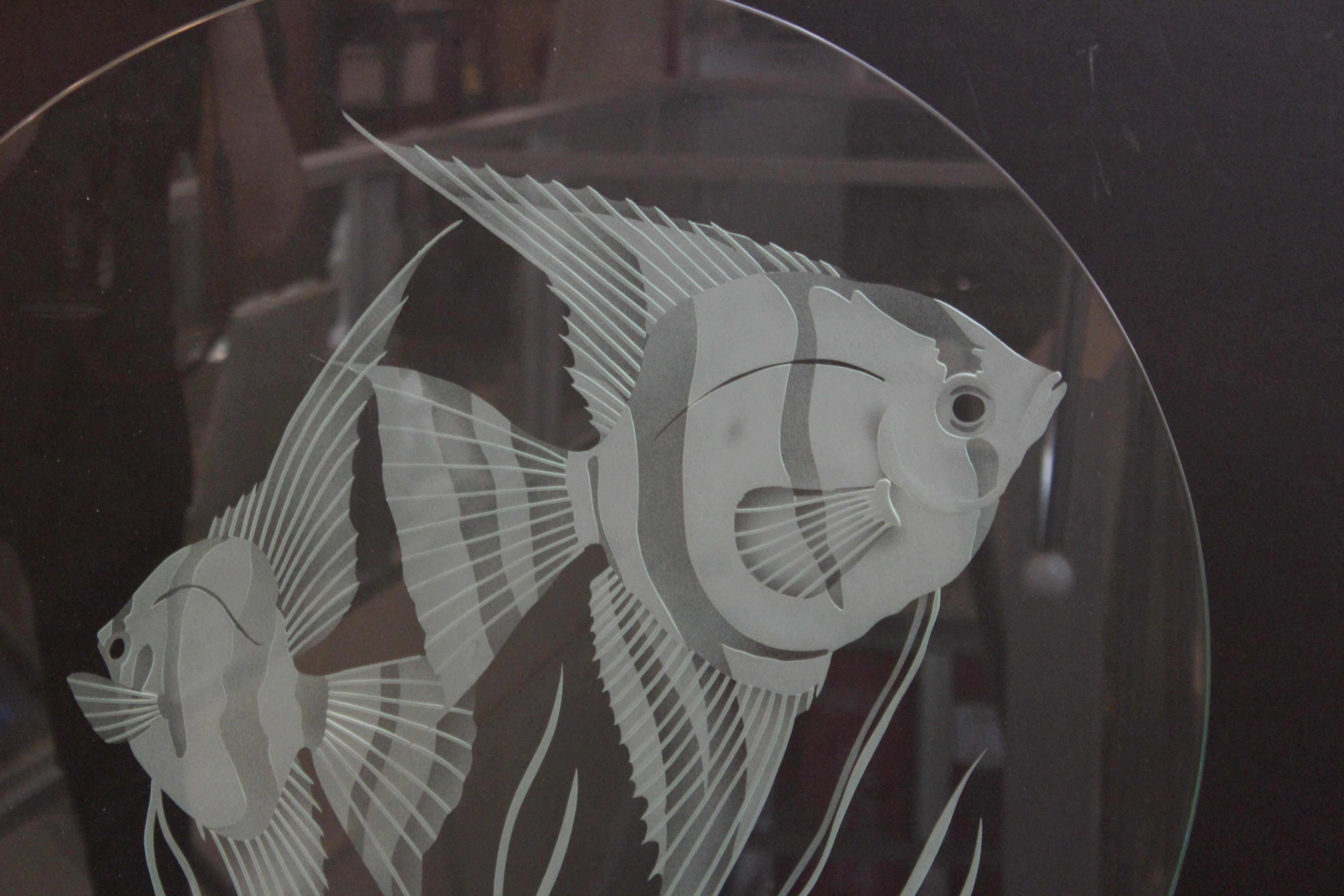 Italian Modern studio art glass disc in clear glass with an etched aquatic scene with fish. The disc is set atop a Lucite base. Illegibly signed and numbered on the lower right side of the disc. The piece is in great vintage condition with