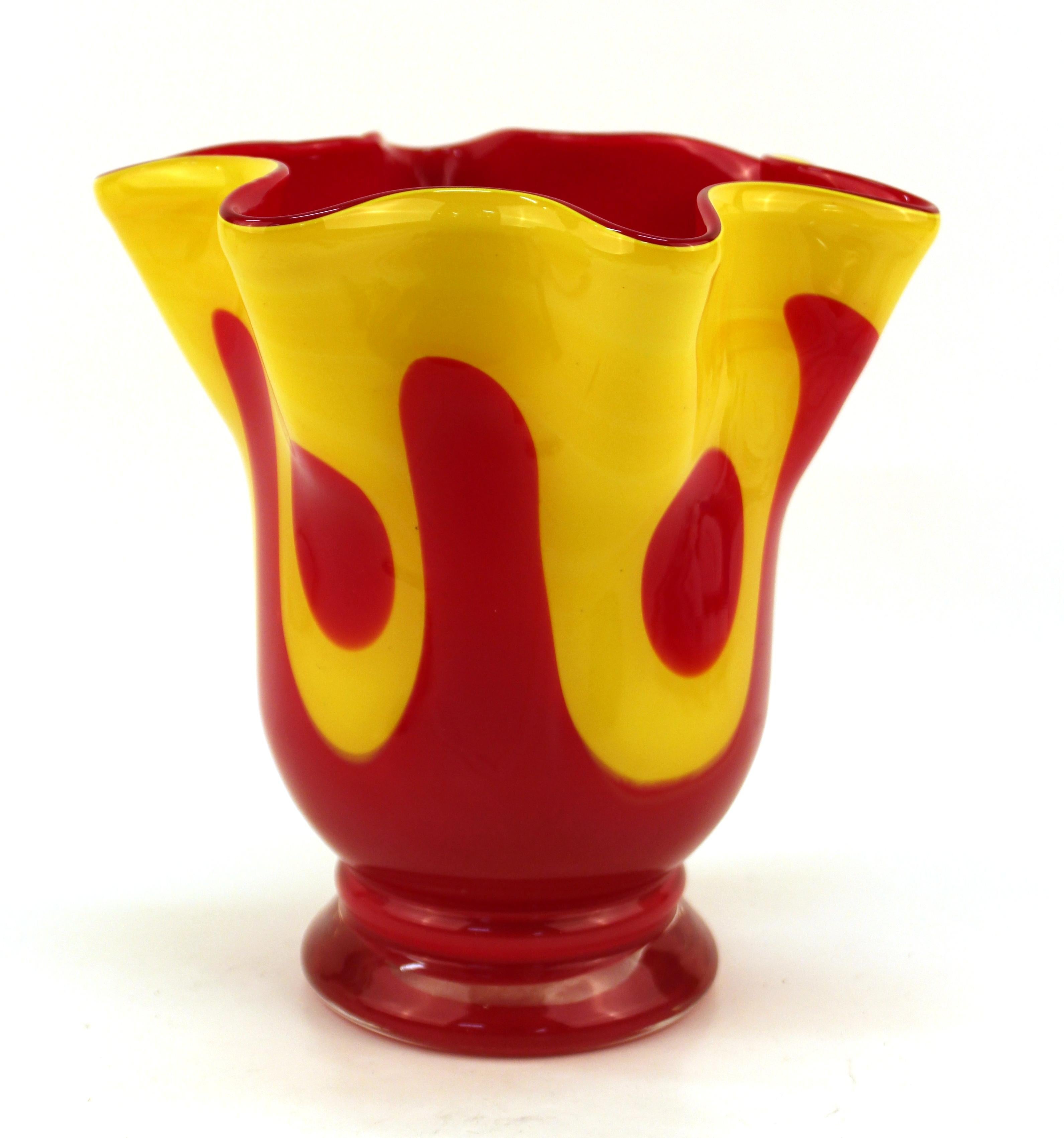Italian modern art glass vase in shape of a handkerchief, designed in red and yellow glass. The piece is reminiscent of pieces from the Fratelli Toso glass-making company. In great vintage condition with age-appropriate wear and use.