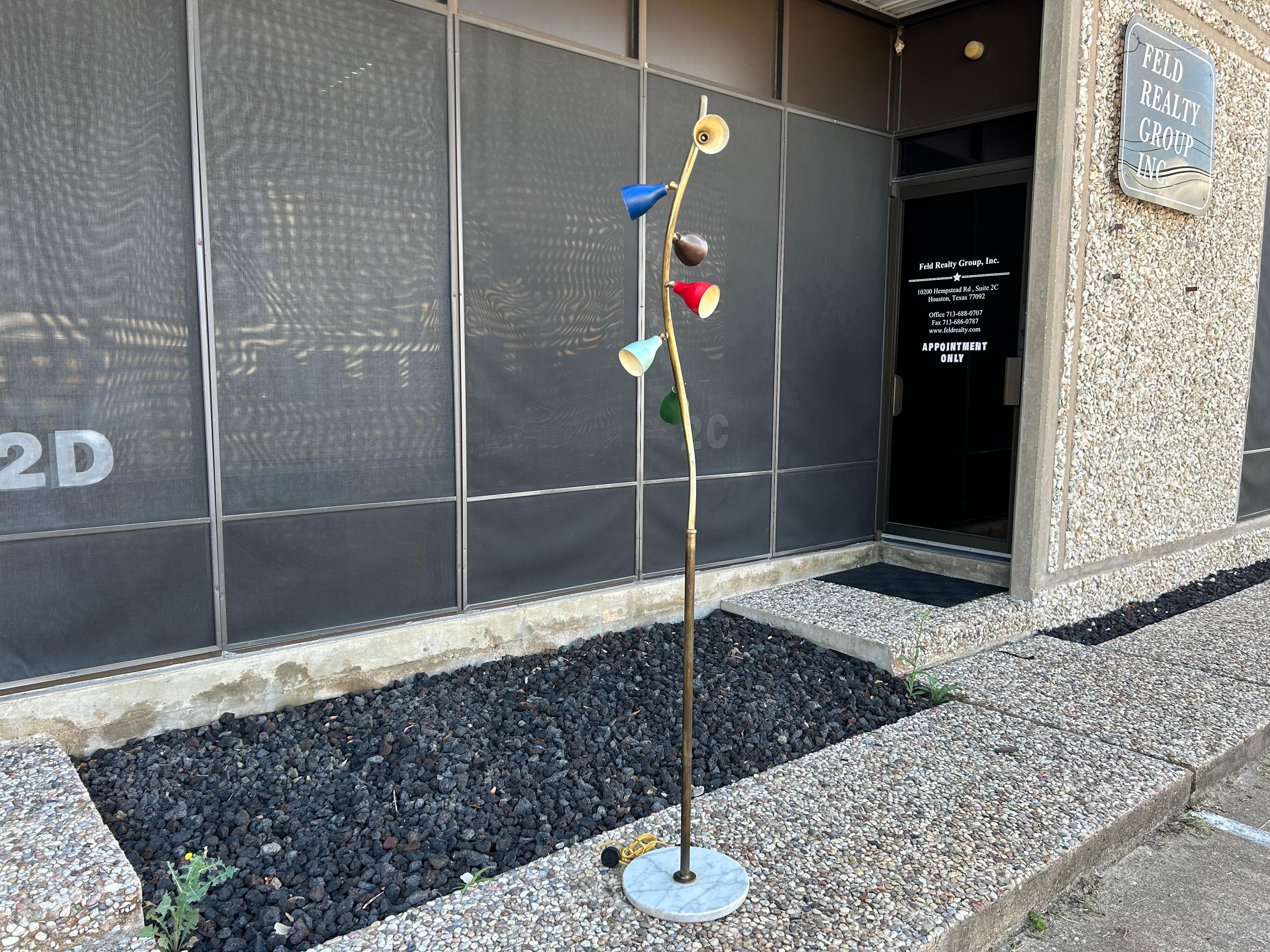 Italian Modern Arteluce Attributed Multi-Cone Floor Lamp.
This stunning Italian mid century floor lamp has six multi colored articulating cone shades each with a new candelabra sockets with a round Carrara marble base. The entire floor lamp has been