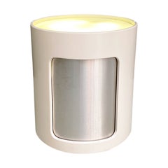 Mueble bar moderno italiano sobre ruedas, puerta corredera y neón interior, años 80