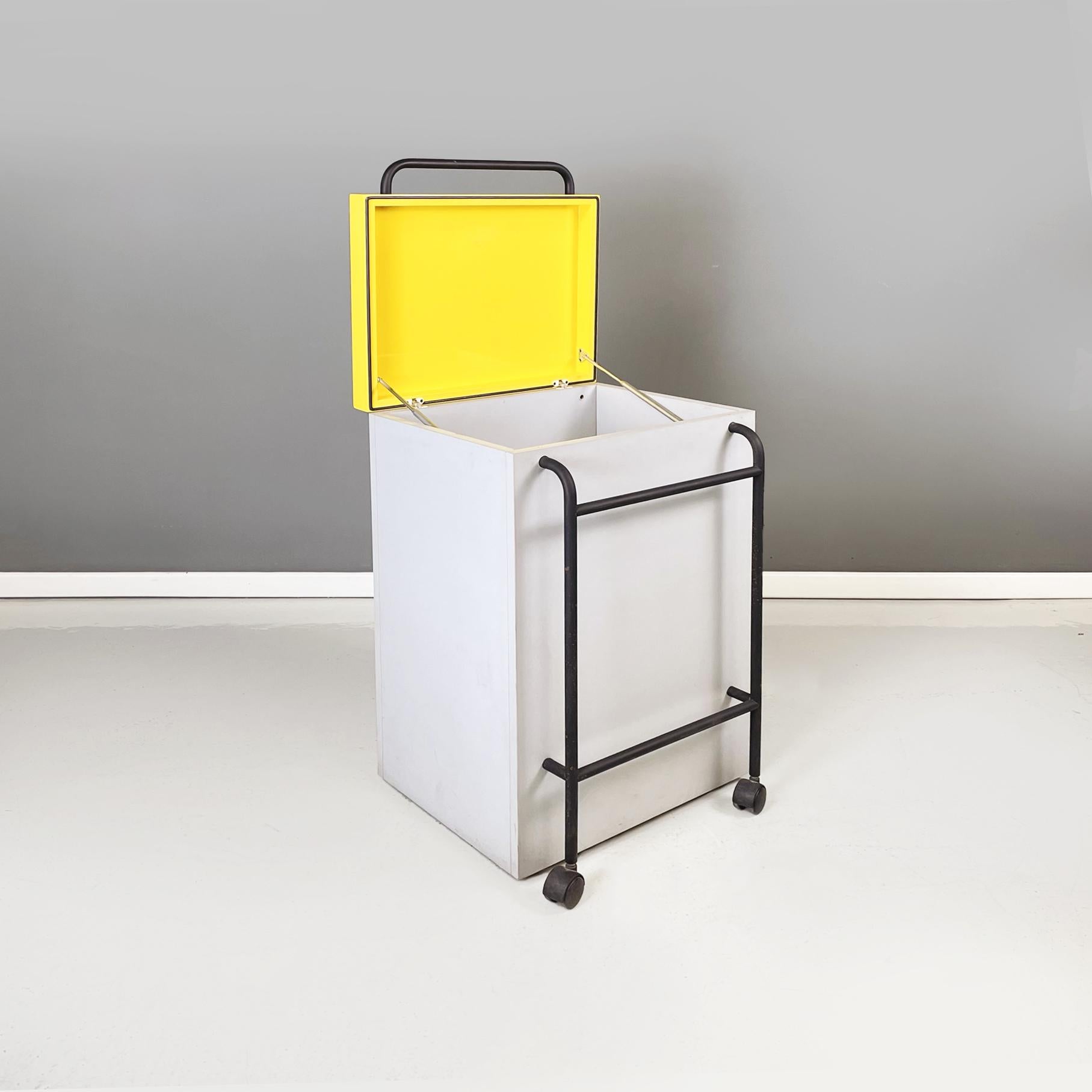 Italian modern basket container in gray and yellow wood and black metal by Robots, 1990s
Floor basket with rectangular base in wood painted in light gray and bright yellow. The lid of the yellow wooden container has a black painted tubular metal