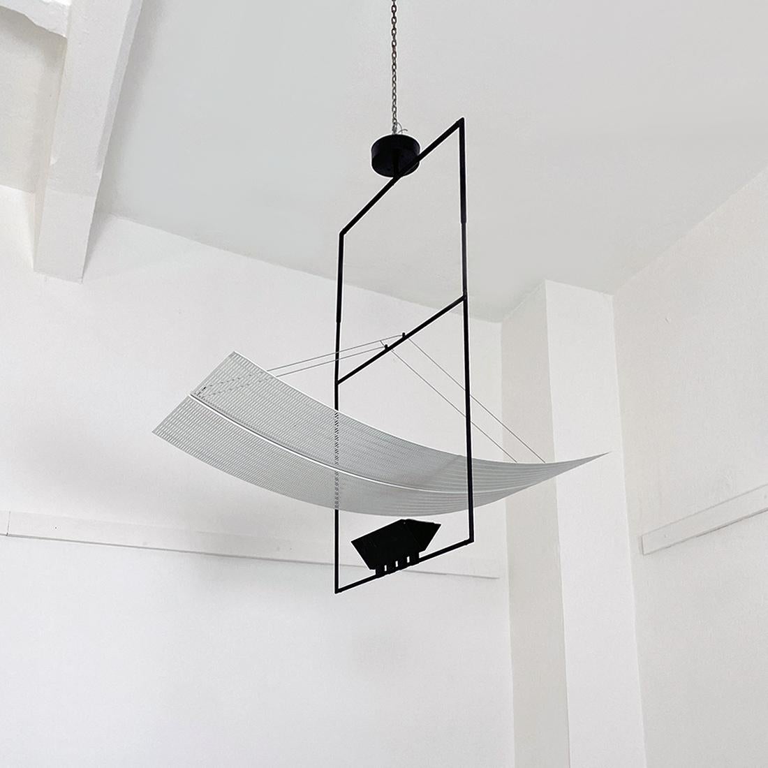 Italian post modern black and white metal Zefiro chandelier by Mario Botta for Artemide, 1980s
Zefiro model chandelier, with structure in black metal rod in the center of which a curved perforated and white enamelled metal wing hangs.
Designed by
