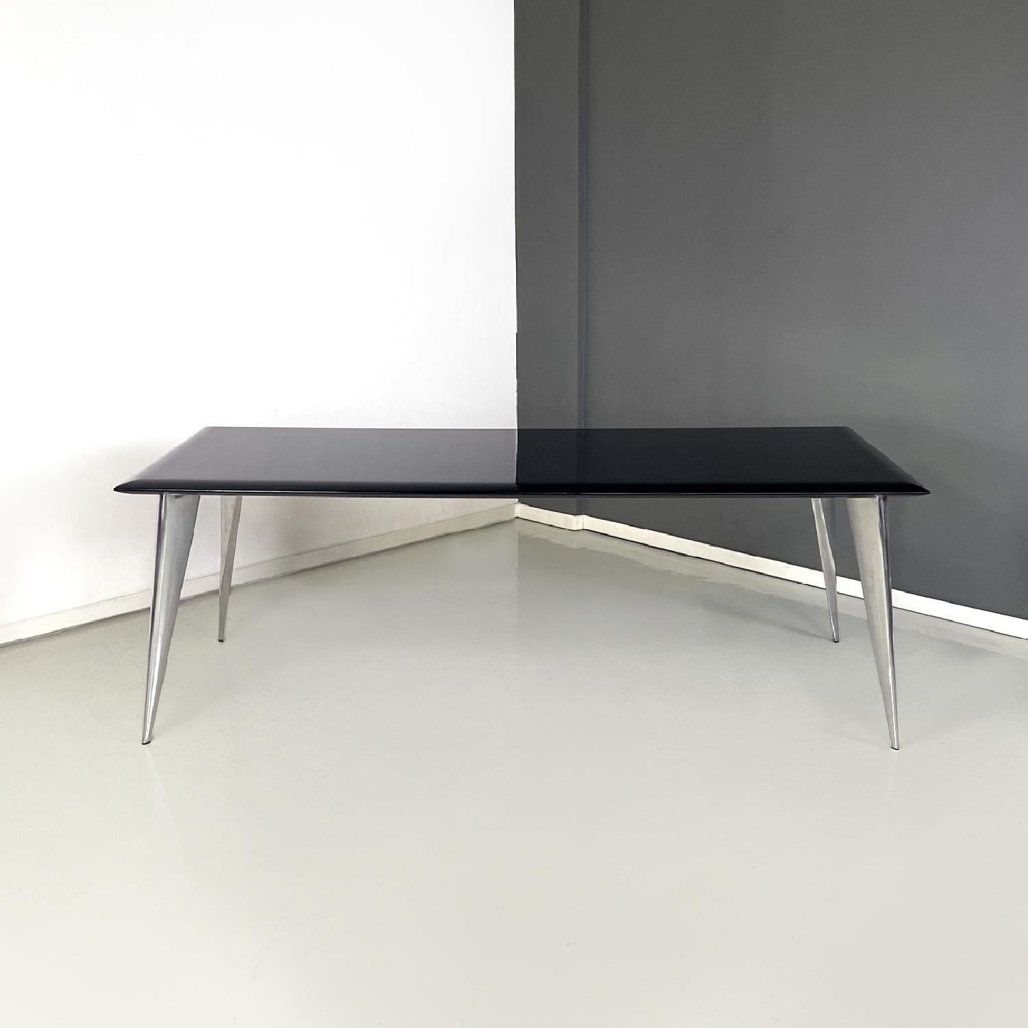 Italian modern black dining table M by Philippe Starck for Driade Aleph, 1980s
Dining table mod. M rectangular in shape. The top is in glossy black painted wood with mirror-like shaping in the lower and upper parts along the entire perimeter. The