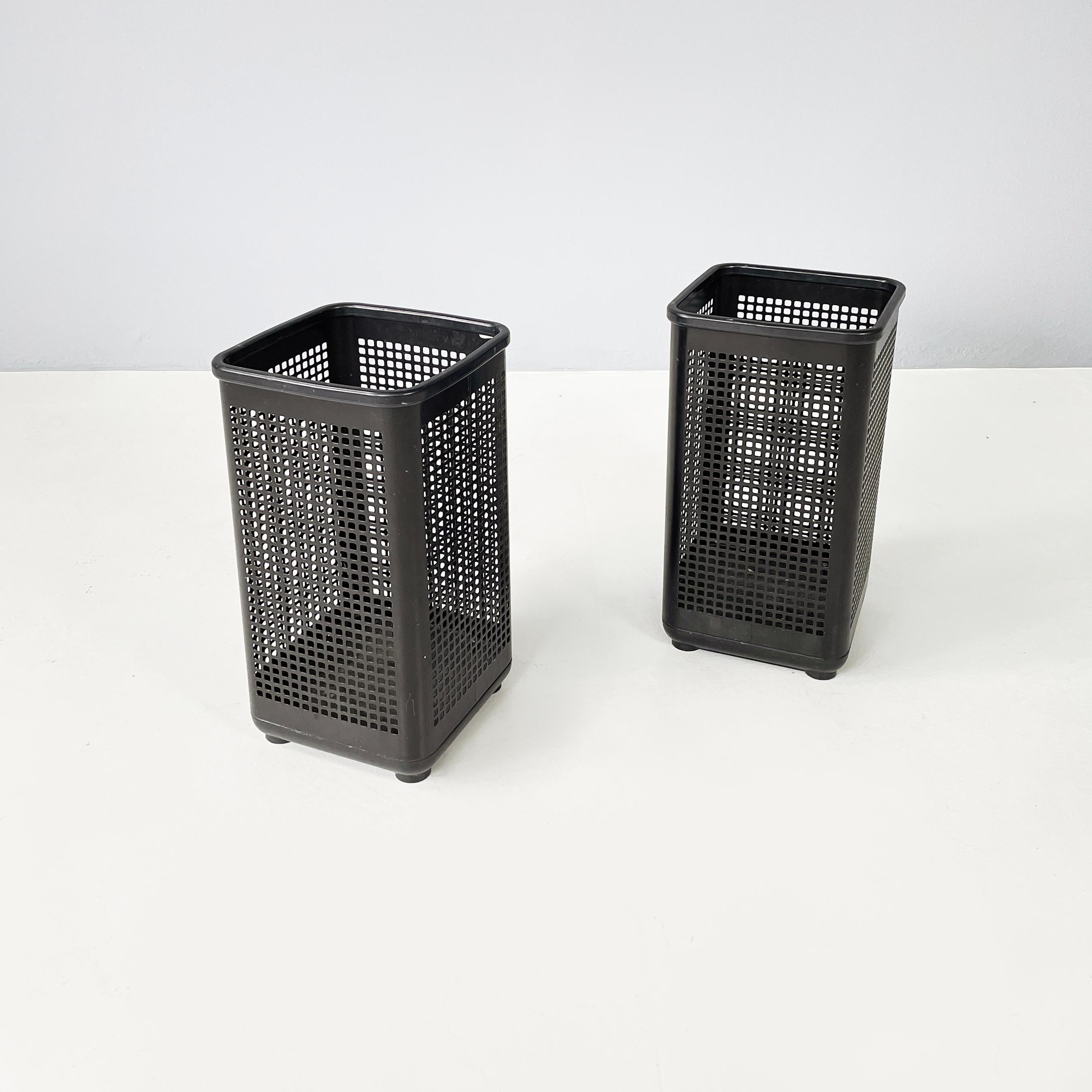 Italian modern Black metal and plastic squared baskets by Neolt, 1980s
Pair of square-based office bins. The main structure is made of a perforated metal sheet with square holes, and is painted black with a matte finish. The top and base with round