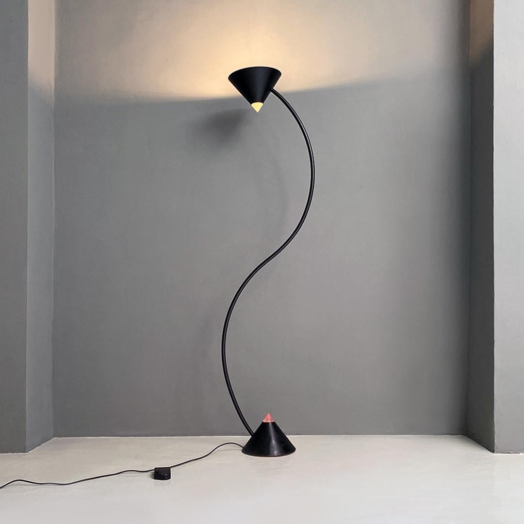 Italian modern black metal and plastic Yang floor lamp by Bieffeplast, 1980s.
Yang model floor lamp with structure in metal and black plastic, with conical base and lampshade placed at the ends of a stem with an odulated shape, in a mirror-like