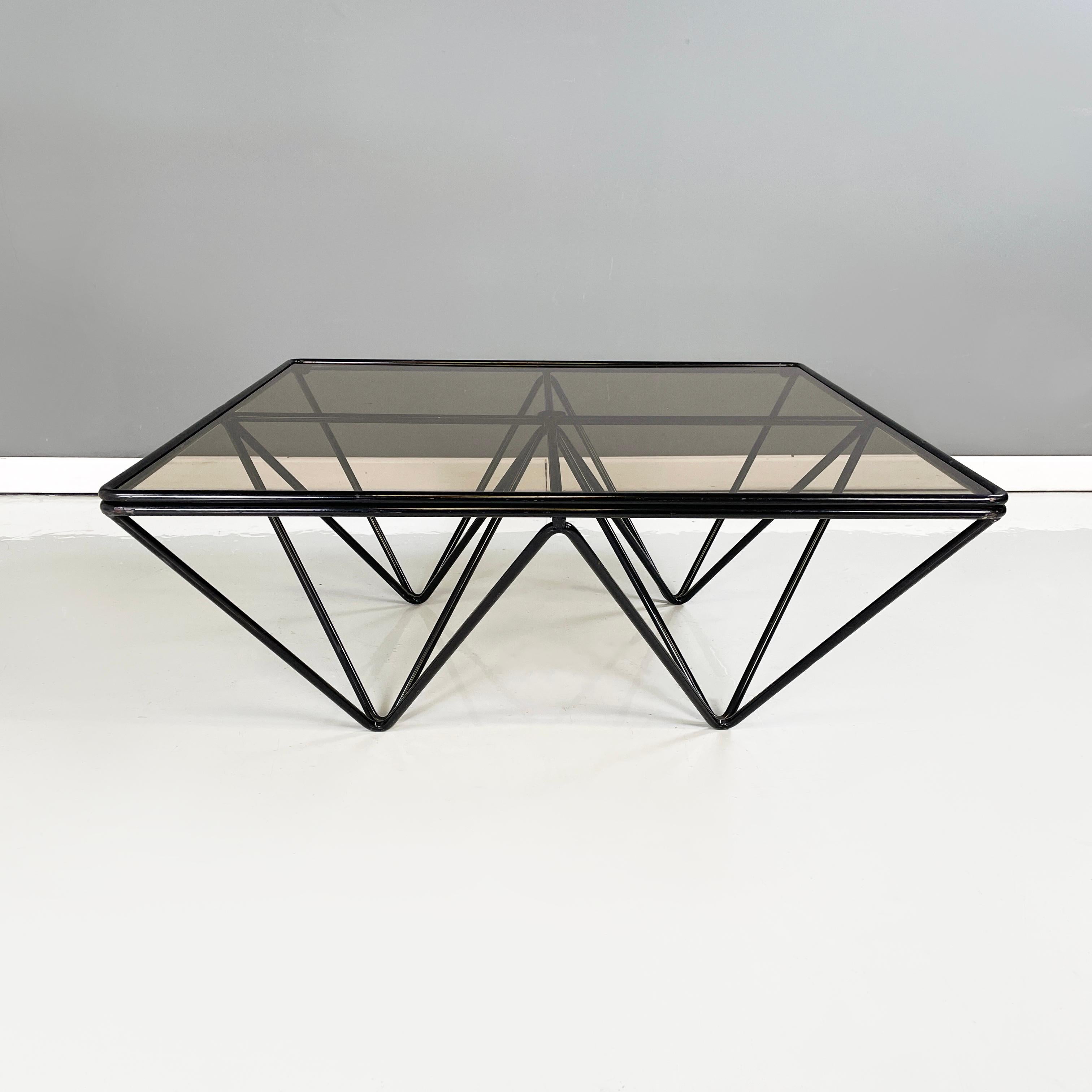 Italian modern Black metal and glass Coffee table Alanda by Paolo Piva for B&B, 1980s
Coffee table mod. Alanda with square top in smoked glass. The structure is made up of a series of black painted metal rods.
Produced by B&B Italia in approx. 1980