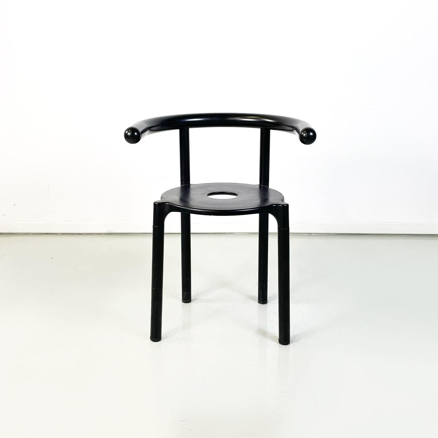 Italian modern Black metal plastic Chairs 4855 by Anna Castelli Kartell, 1990s
Set of 12 dining room chairs mod. 4855 with round seat with a hole in the centre, in plastic and black metal. The cockpit-shaped structure has curved armrests with a