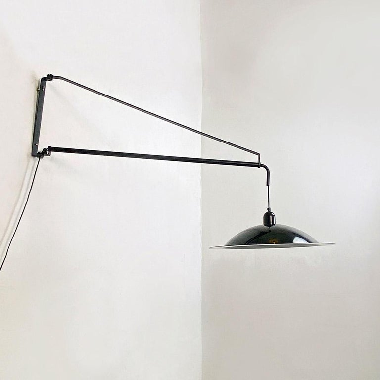Italian modern black metal telescopic wall lamp Stilnovo, De Pas, D'urbino, Lomazzi, 1980s
The lamp is designed by De Pas D'urbino Lomazzi for Stilnovo in 1980 period
Wall lamp in black metal, with telescopic structure and with counterweight along