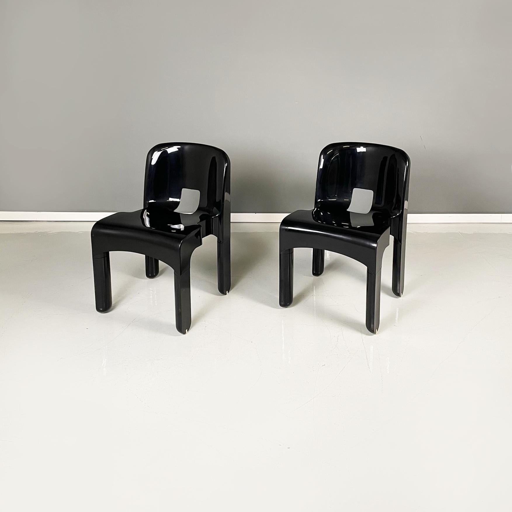 Italian modern black plastic ABS chairs mod. 4868 by Joe Colombo for Kartell, 1970s
Pair of fantastic chairs mod. 4868, also known as the Universal Chair, in glossy black ABS plastic. The slightly curved backrest is rectangular with rounded upper