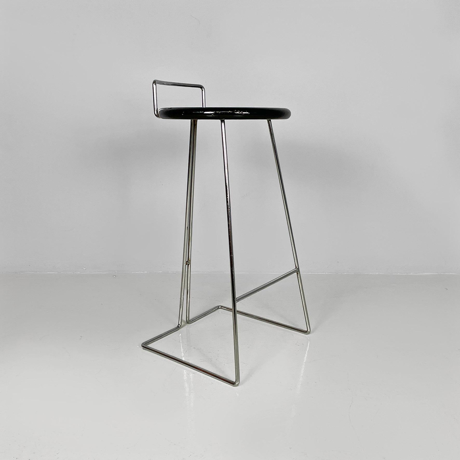 Italian modern black wood and chromed metal stool by George Coslin, Dada 1980s.
Stool with round seat in black painted wood with a glossy finish and structure with footrest, composed of a thin chromed metal rod.
Produced by Dada in approx. 1980. and