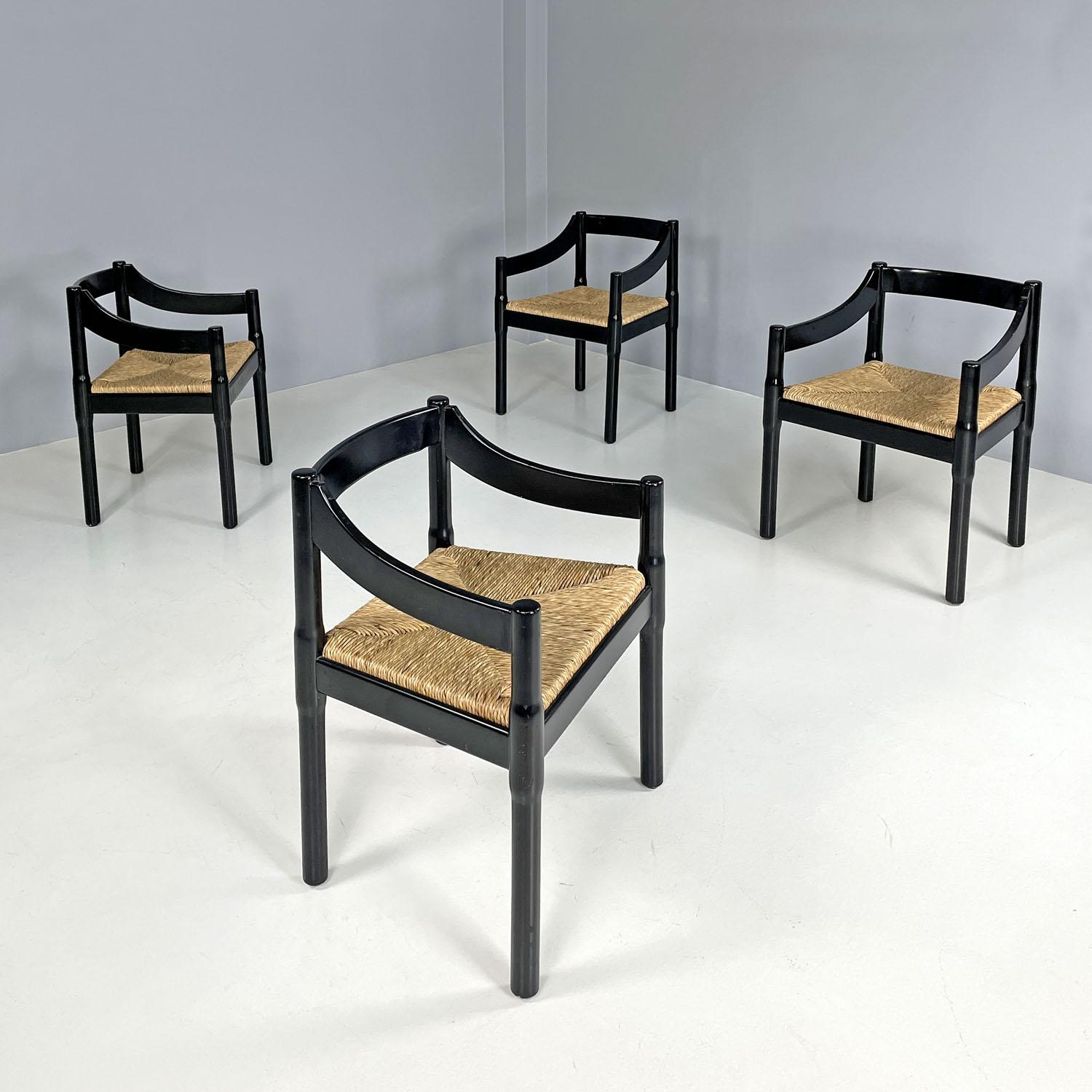 Italian modern black wood chairs Carimate by Vico Magistretti for Cassina, 1970s
Set of four chairs mod. Carimate in black lacquered wood with glossy finish and straw seat. The armrests and backrest have a rectangular section and have decorative