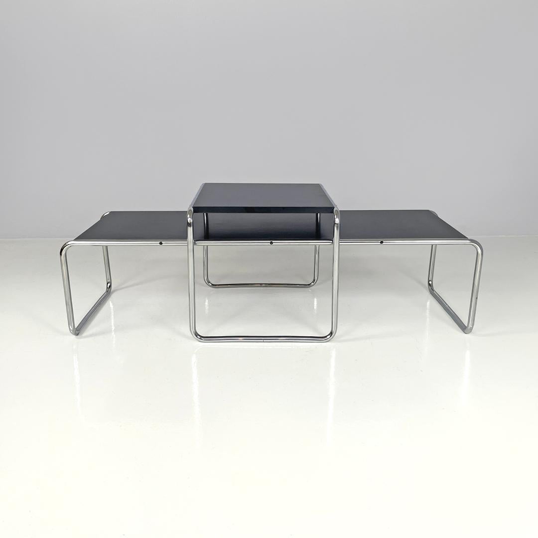 Tavolini moderni italiani in legno nero Laccio di Marcel Breuer per Gavina anni '70
Tavolini da caffè mod. Laccio in legno e metallo. Le strutture sono realizzate in tubolare d'acciaio cromato e formano le gambe e la struttura portante. I piani sono
