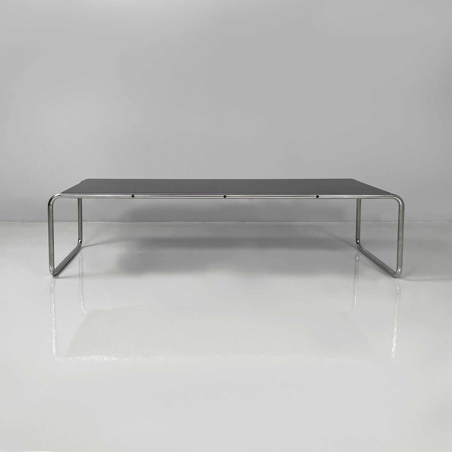 Italian modern black wood and chromed steel coffee table Laccio by Marcel Breuer for Gavina, 1970s
Iconic and fantastic coffee table model Laccio with a rectangular wooden top covered in black laminate. The structure and legs are made of a single