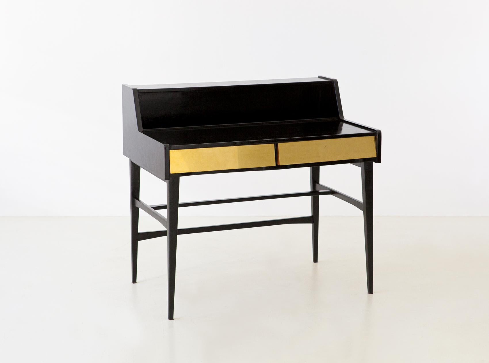 Italian modern writing table with row brass laminated drawers

Made of black lacquered wood by hand with shellac

Elegant and precious, light and modern design

Fully restored

The brass has been polished (however, some very small signs
