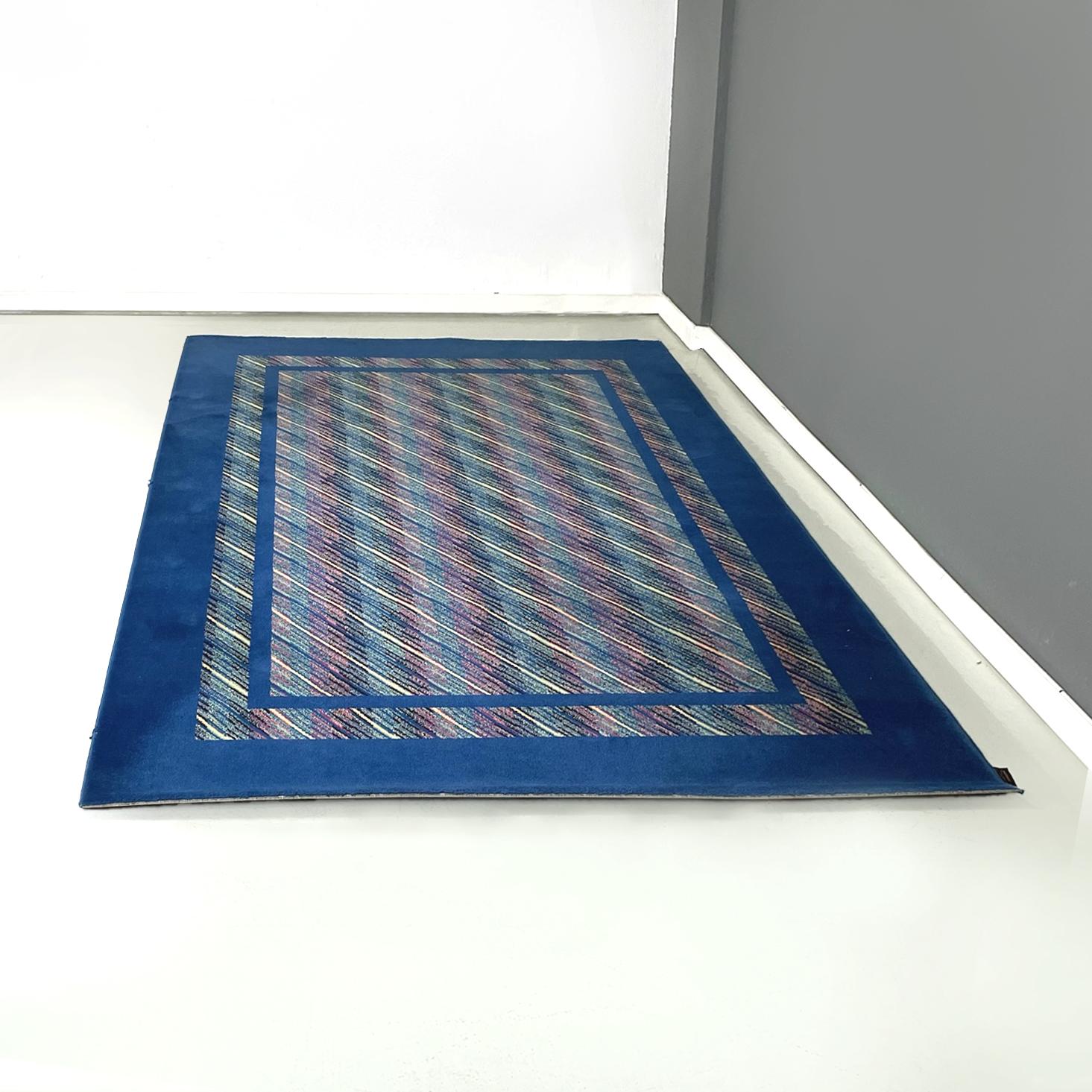 Italian modern blue wool rectangular carpet by Missoni, 1990s
Rectangular carpet in pure virgin wool fabric. The profiles of the rug are in bright blue, the interiors are thin stripes of different colors: yellow, pink, black and green.
Produced by