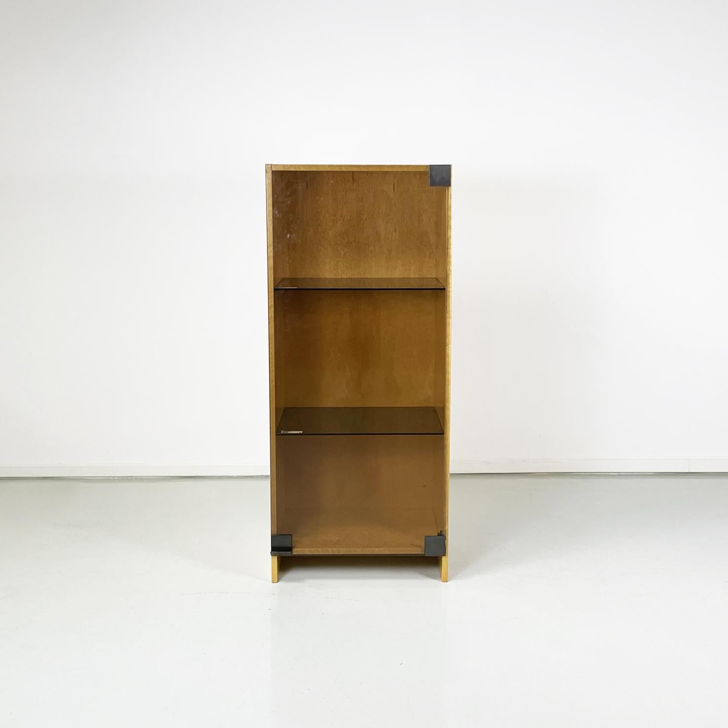 Italian modern Bookcase by Saporiti in light briar and smoked glass, 1970s
Rectangular wall bookcase or sideboard in light briar. It has of a hinged door in smoked glass, inside there are 3 compartments with 2 shelves in smoked glass.
Produced by