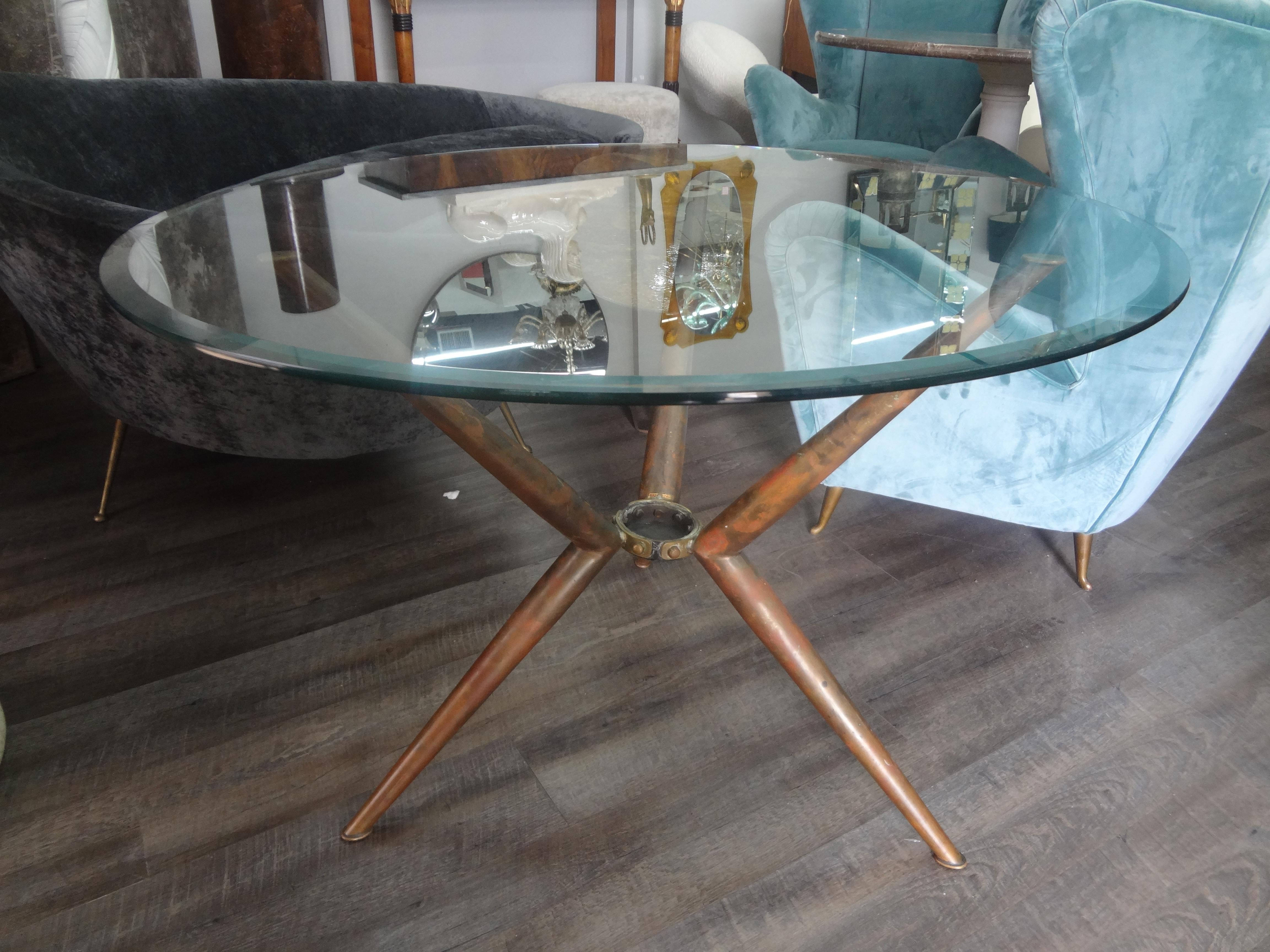 Italian Modern Brass Tripod Center Table With Glass Top. Our lovely Italian Gio Ponti inspired brass center table, dining table, or side table retains the original beveled glass top and the base is marked Italy.
Fabulous!