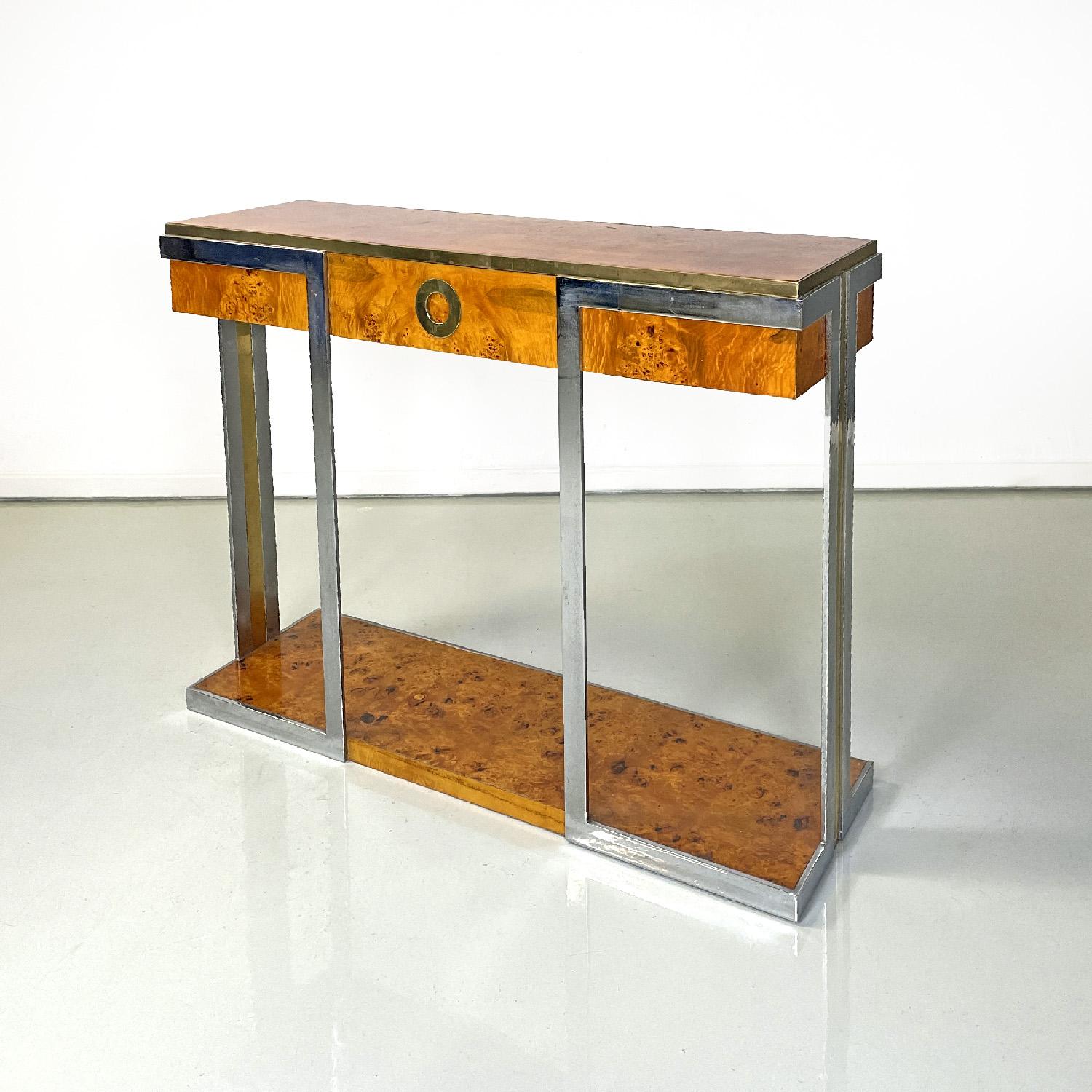 Italian modern briar and chromed metal console by D.I.D., 1980s
Console with two rectangular briar tops. The profile of the upper shelf is given by a golden metal strip, it has a drawer with a round hole that acts as a handle covered in the same