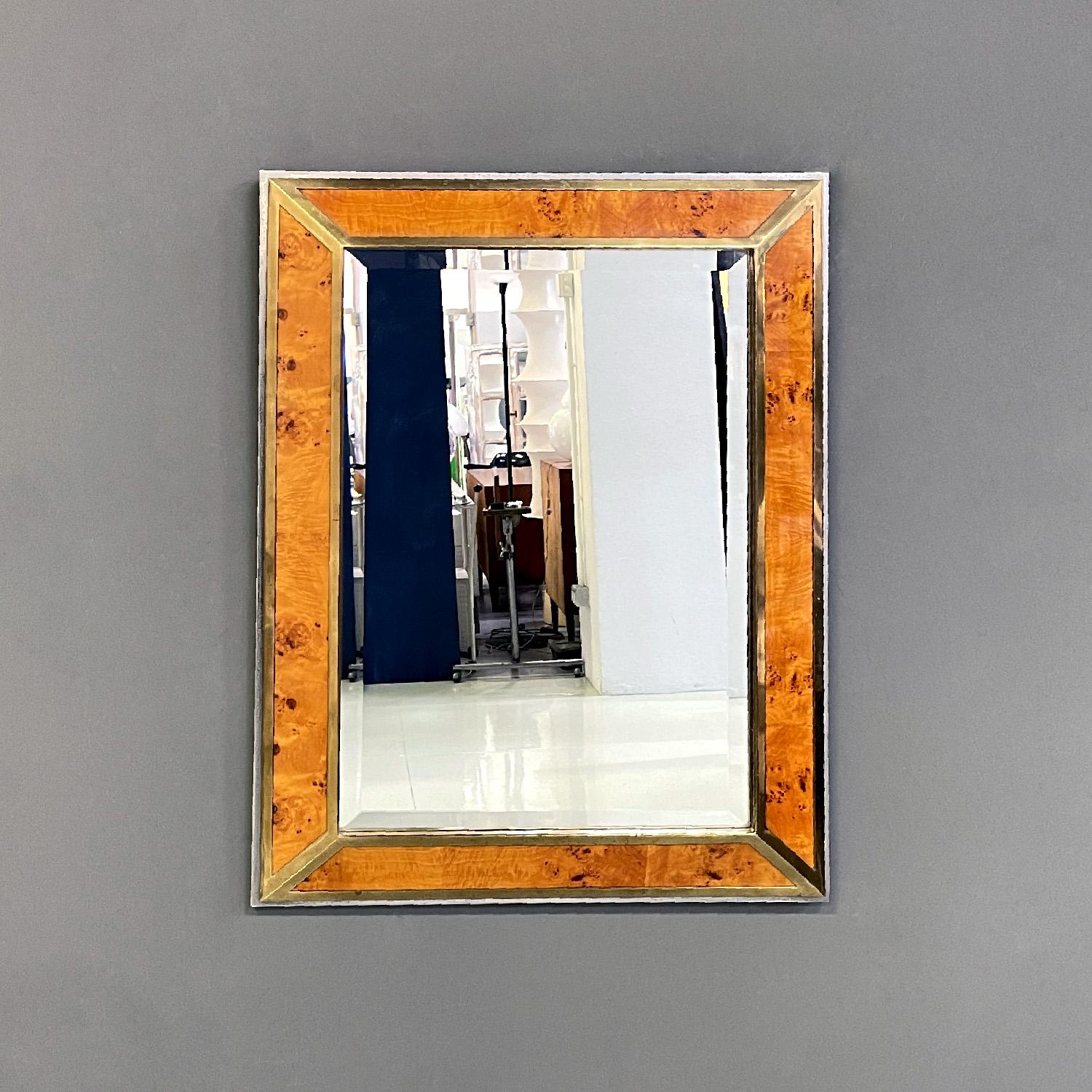 Italian modern briar root brass and chromed metal wall mirror by D.I.D., 1980s
Rectangular wall mirror. The frame is made up of four parts of briar with brass profiles that rest on a raised chromed metal base.
Produced by D.I.D. Dada Industries