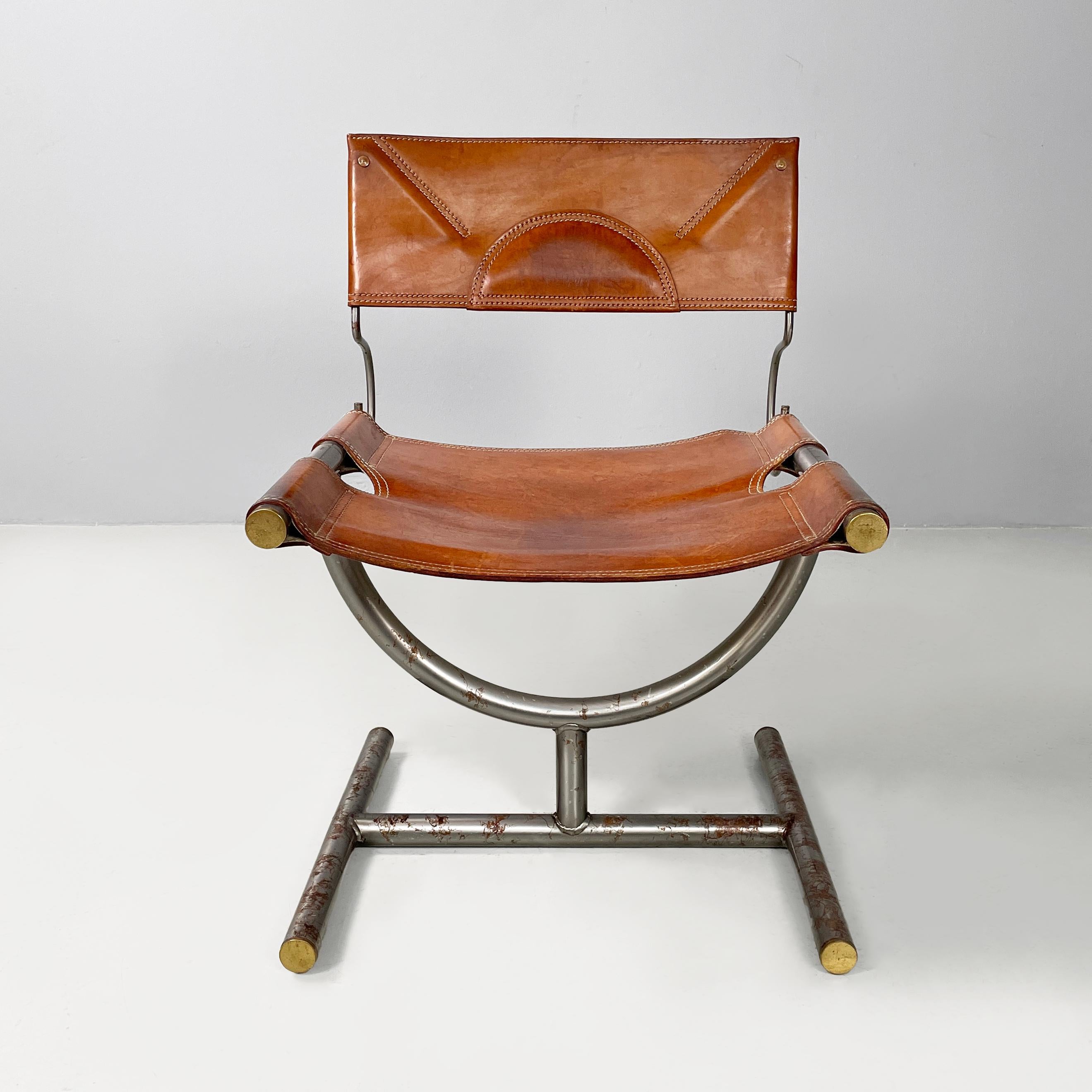 Italian modern brown leather and steel chairs Benetton by Afra and Tobia Scarpa, 1980s
Pair of chairs with rectangular seat and backrest in cognac brown leather. The structure that connects the seat and backrest is in curved steel rod. The seat is