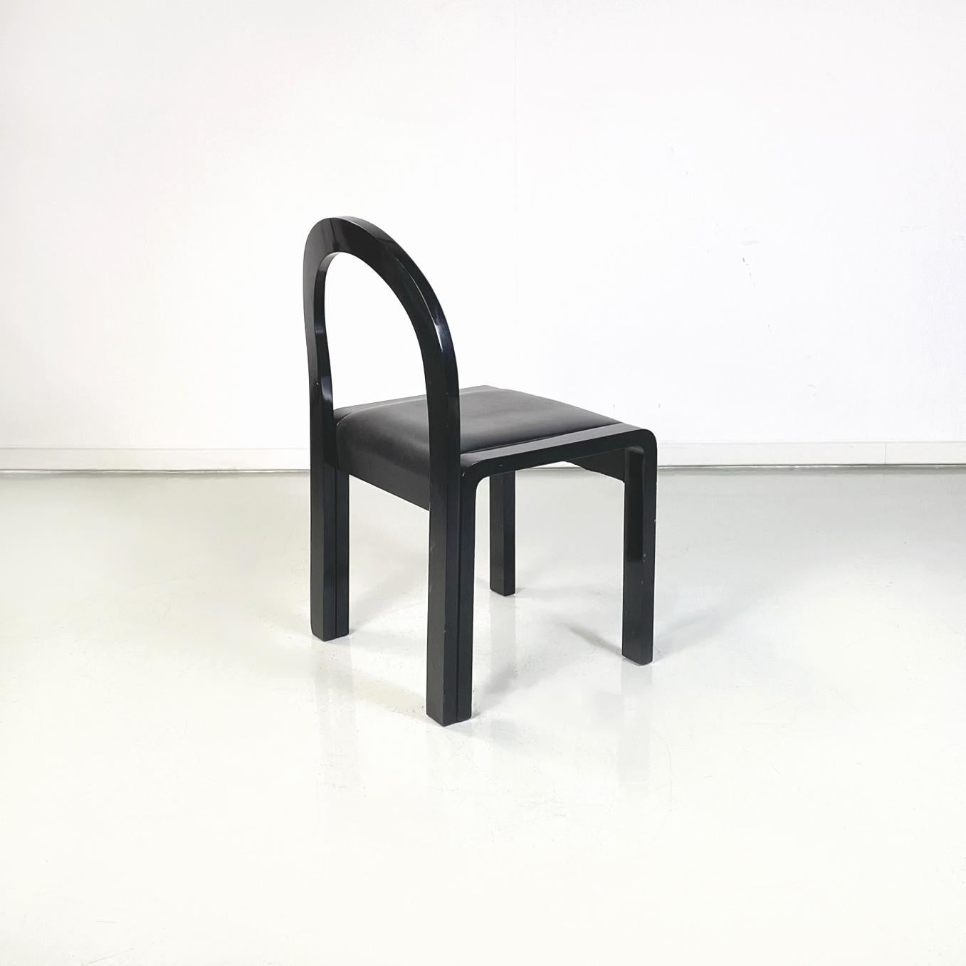 Late 20th Century Italian modern Chairs in black lacquered wood and black leather, 1980s For Sale