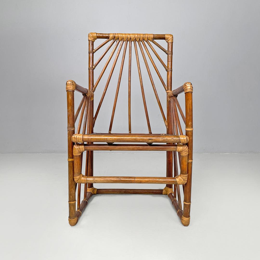 Italian modern chairs in rattan by Dal Vera with radial structure, 1970s
Set of four chairs entirely in rattan. The backrest and the two armrests are made of radial slats, the chairs have a footrest. The structure develops slightly diagonally and at