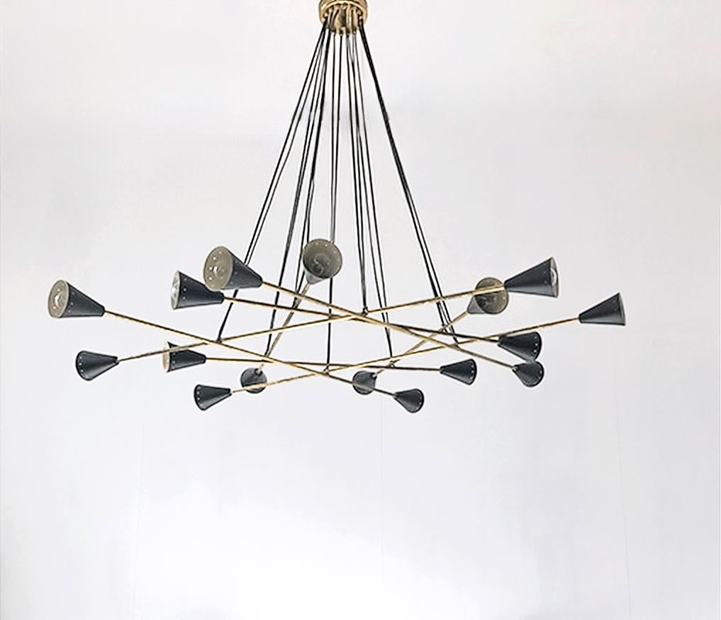 Wildly sculptural chandelier shown in un-lacquered natural brass with black shades fabricated in Italy by Fabio Ltd. 

This is a modern, contemporary interpretation of a classic chandelier, strongly influenced by Italian Mid-Century Modernism such