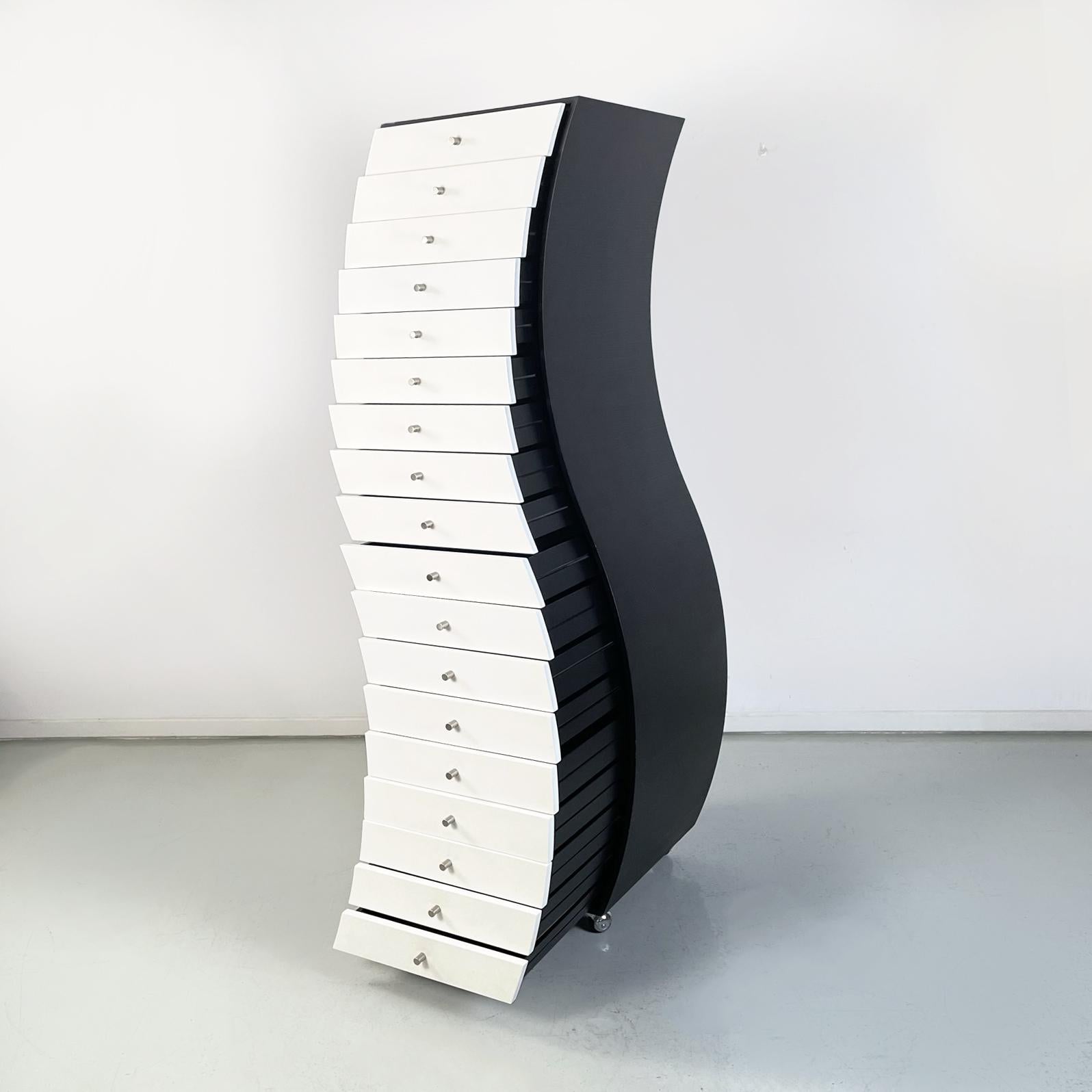 Italian modern Chest of drawers Side 1 by Shiro Kuramata for Cappellini, 1990s
Chest of drawers mod. Side 1 with a sinuous silhouette in wood. The black painted wooden structure supports a series of 18 white wooden drawers with cylindrical handles