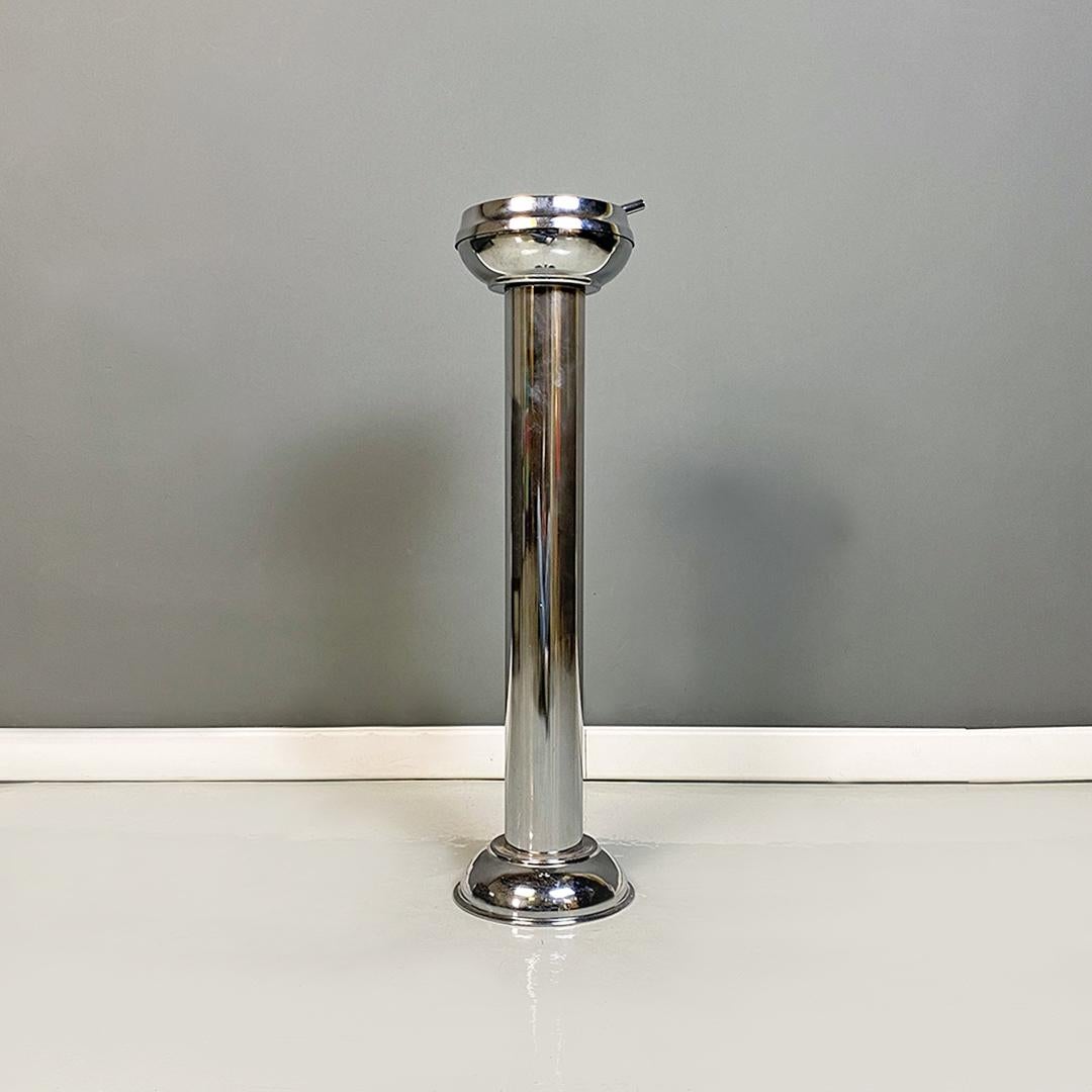 Italian modern chromed steel ashtray with cigarette extinguisher, 1970s
Chromed steel ashtray with cigarette extinguisher, round base structure with cylindrical stem. Provided with the original cigarette extinguisher, which in turn consists of a