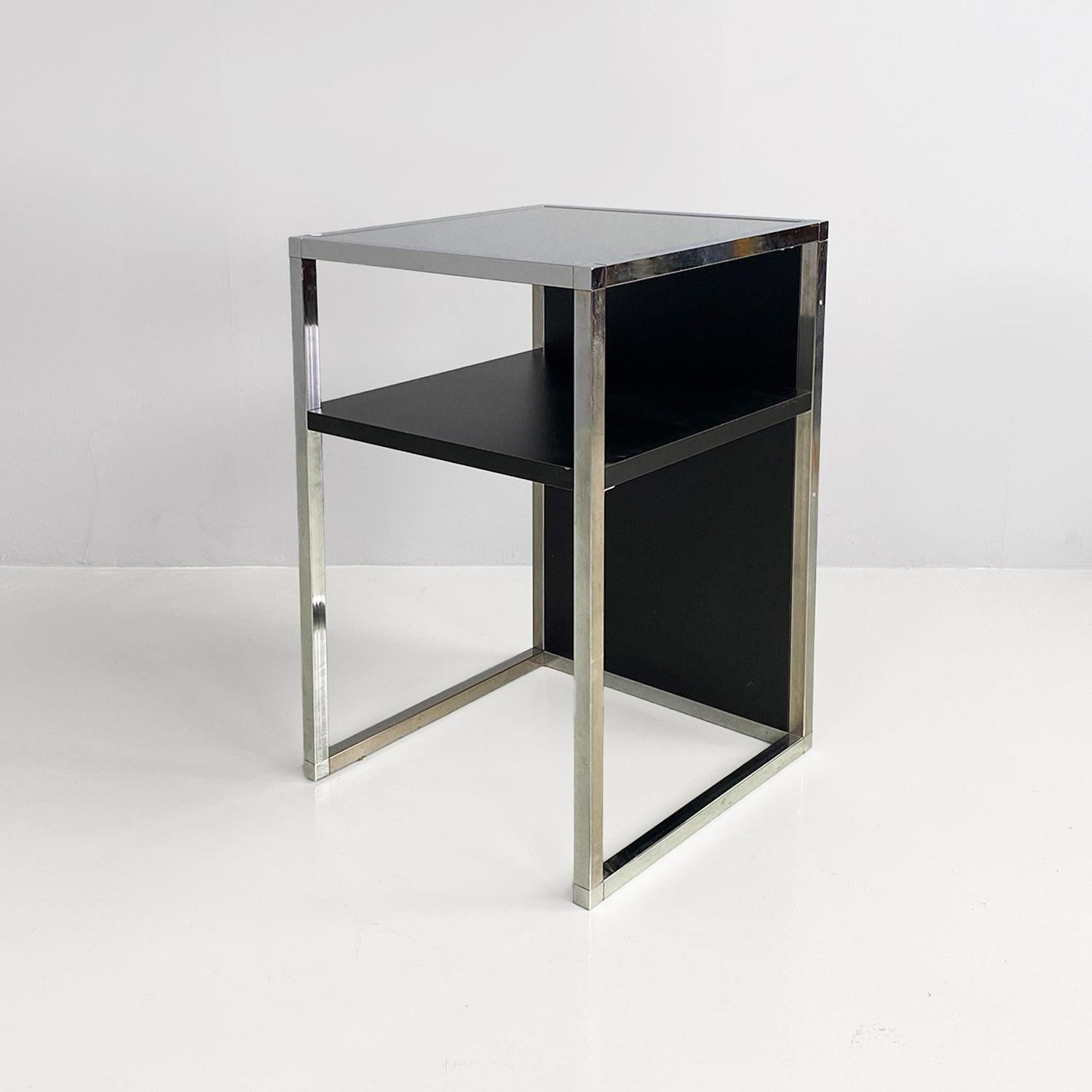Italian modern chromed steel, wood and glass table for stereo and vinyls, 1990s.
Table for stereo and for storing vinyl records, with a square section structure in chromed steel, with a solid wood top covered in glass with a matt black finish and a
