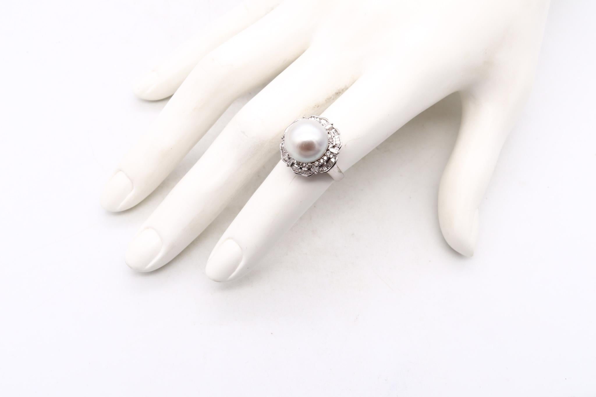 Jeweled cocktail ring with a Pearl.

A classic ballerina style piece, crafted in Italy in solid white gold of 18 karats. Mount in the center, with one cultured white pearl of 12 mm that is surrounded by natural white color-less diamonds, described