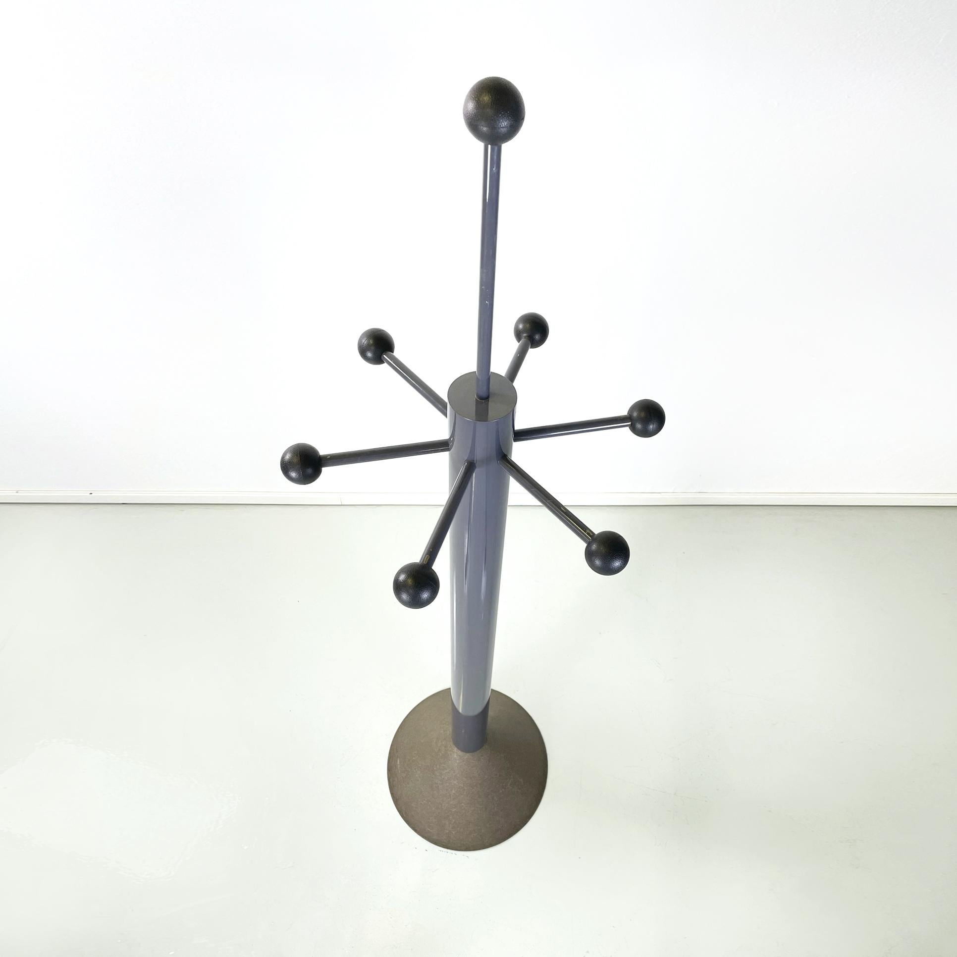 Italian modern Coat stand mod. Velasca by Alessandro Mendini for Elam UNO, 1980s
Coat stand mod. Velasca with a round base. The structure consists of a central column with a round section in gray painted metal, where the coat hangers are placed on