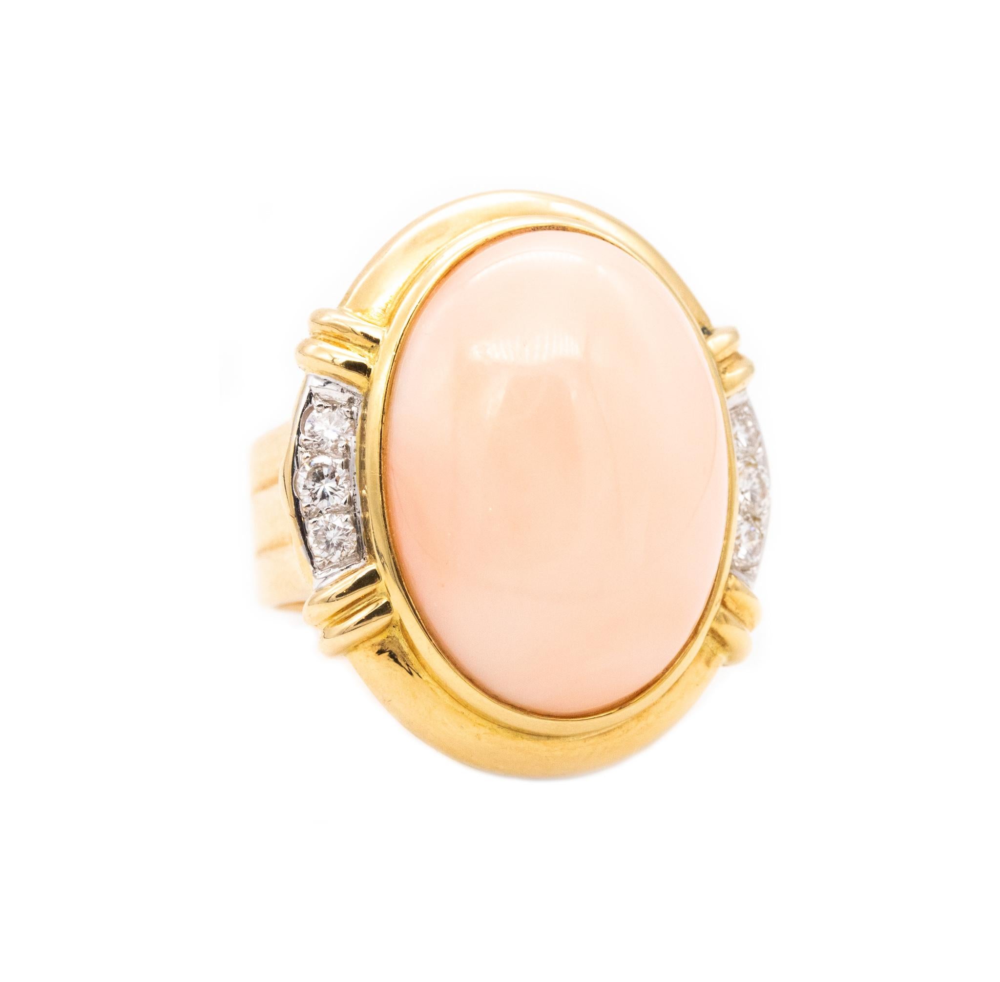 Classic Cocktail ring with coral.

A modern Italian designer's bold piece, crafted in solid yellow gold of 18 karats, with high polished finish. Mount on top in a bezel setting, with a oval cabochon cut (17 x 23 x 10 mm) of a natural angel's skin