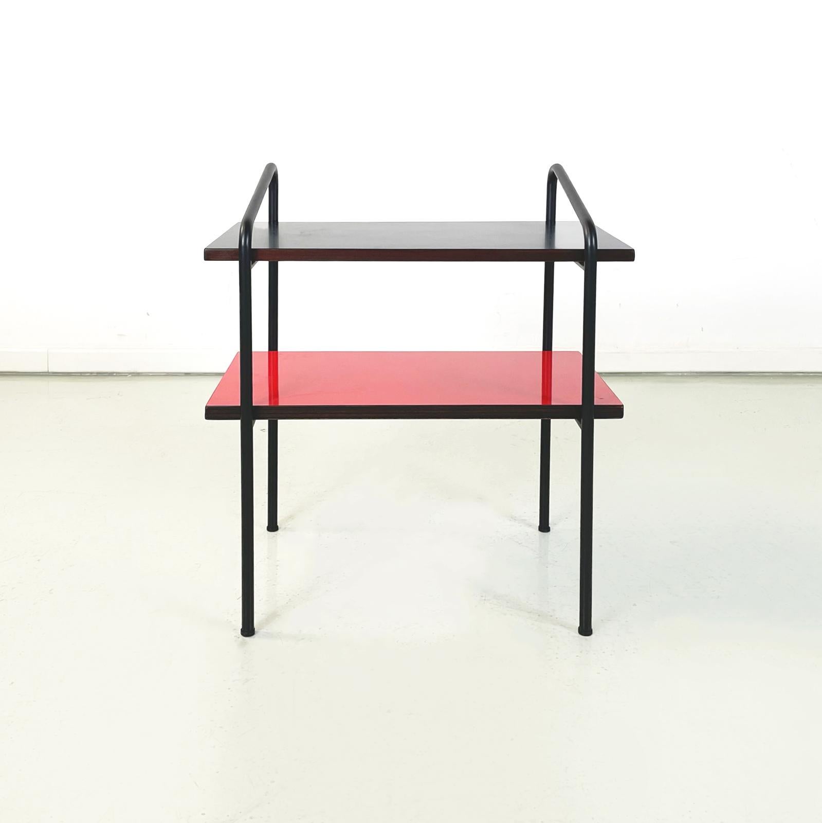 Italian modern Coffee table or bedside table in formica and black metal, 1960s
Coffee table with double shelf in formica with brown edge in walnut color. The upper shelf is in matte black, the lower shelf is in lacquered bright red. The structure is