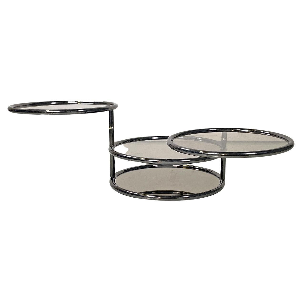 Italian modern coffee table in smoked glass and metal with swivel tops, 1970s For Sale