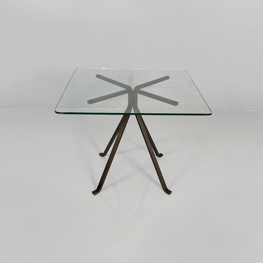 Italian modern coffee table in metal and glass Cuginetto by Enzo Mari for Driade, 1970s
Coffee table model Cuginetto with a thick square glass top and rounded corners. The base is made up of four cast iron spokes with a rectangular section, with the