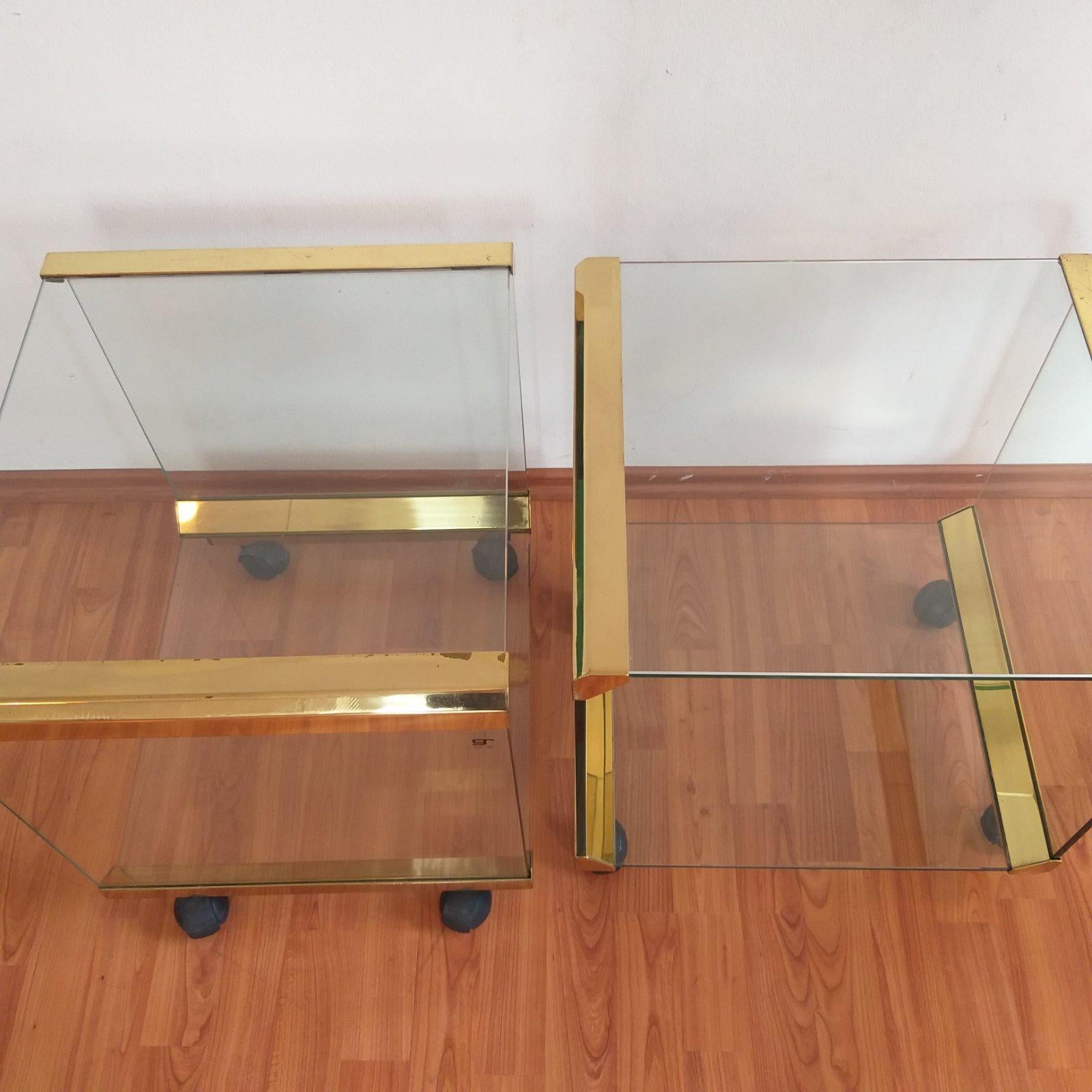 Pair of Italian brass and glass coffee or side tables.
Designed by Pierangelo Galotti for Galotti & Radice in the 70s.

Both in very good vintage condition.