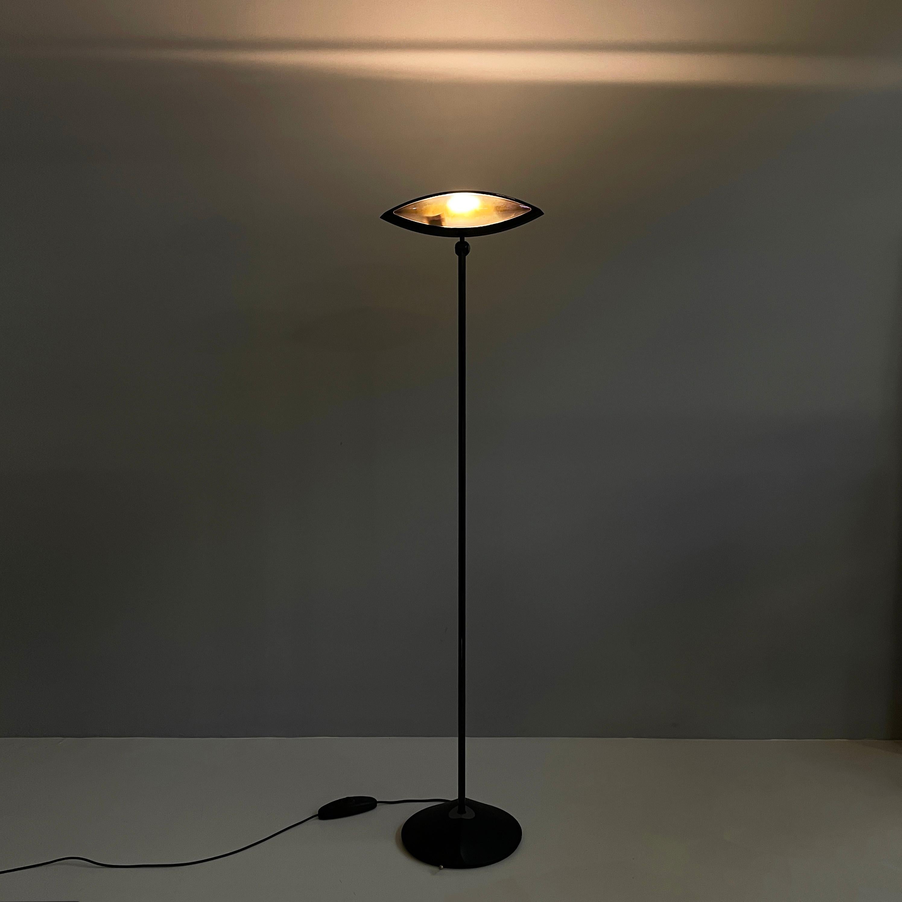 Italian modern color glass and metal Floor lamp Aeto by Fabio Lombardo for Flos, 1980s
Iconic and fantastic floor lamp mod. Aeto with eye-shaped diffuser. This is made of black painted metal with a double colored glass on the sides and a transparent