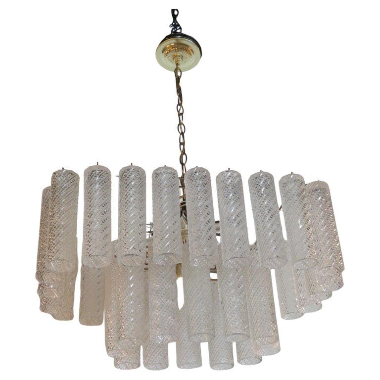 Delightful Murano confection two tier rectangular chandelier of Murano blown crystal in tube form with swirling bubbles in relief in a waterfall style…just stunning. With 36 crystals and 8 lights, the two lights on bottom tier need to be indicator