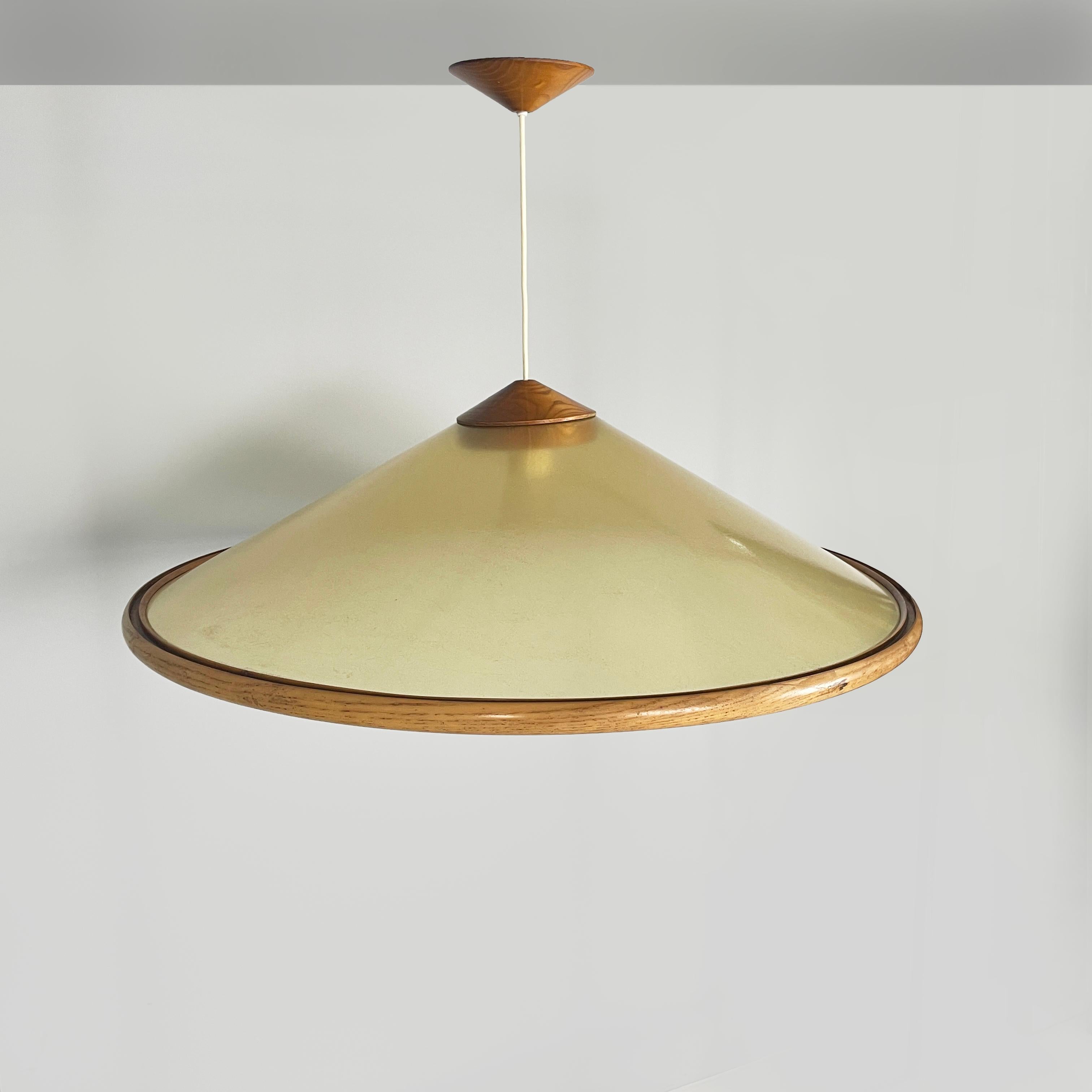 Italian modern Conical chandelier in green fiberglass and wood, 1980s
Fantastic and vintage round base chandelier in sage green fiberglass and wood. The conical lampshade is made of semi-transparent green fiberglass. The profile is made of wood with