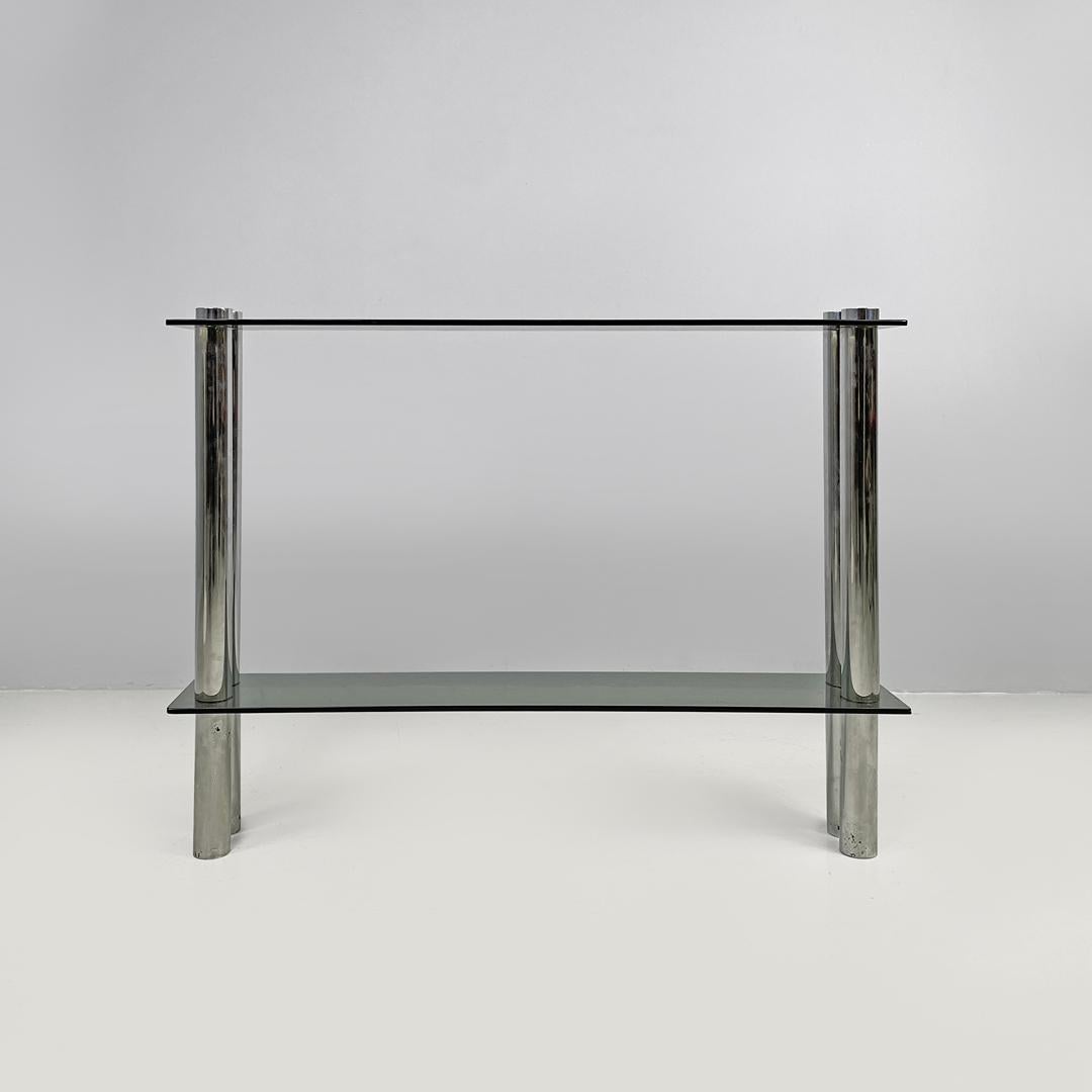 Italian modern console with two smoked glass tops and chromed metal legs, 1970s
Console with two shelves in smoked grey glass. The structure is composed of four chromed metal tubes.
1970s.
Fair condition, with signs of aging, scratches and