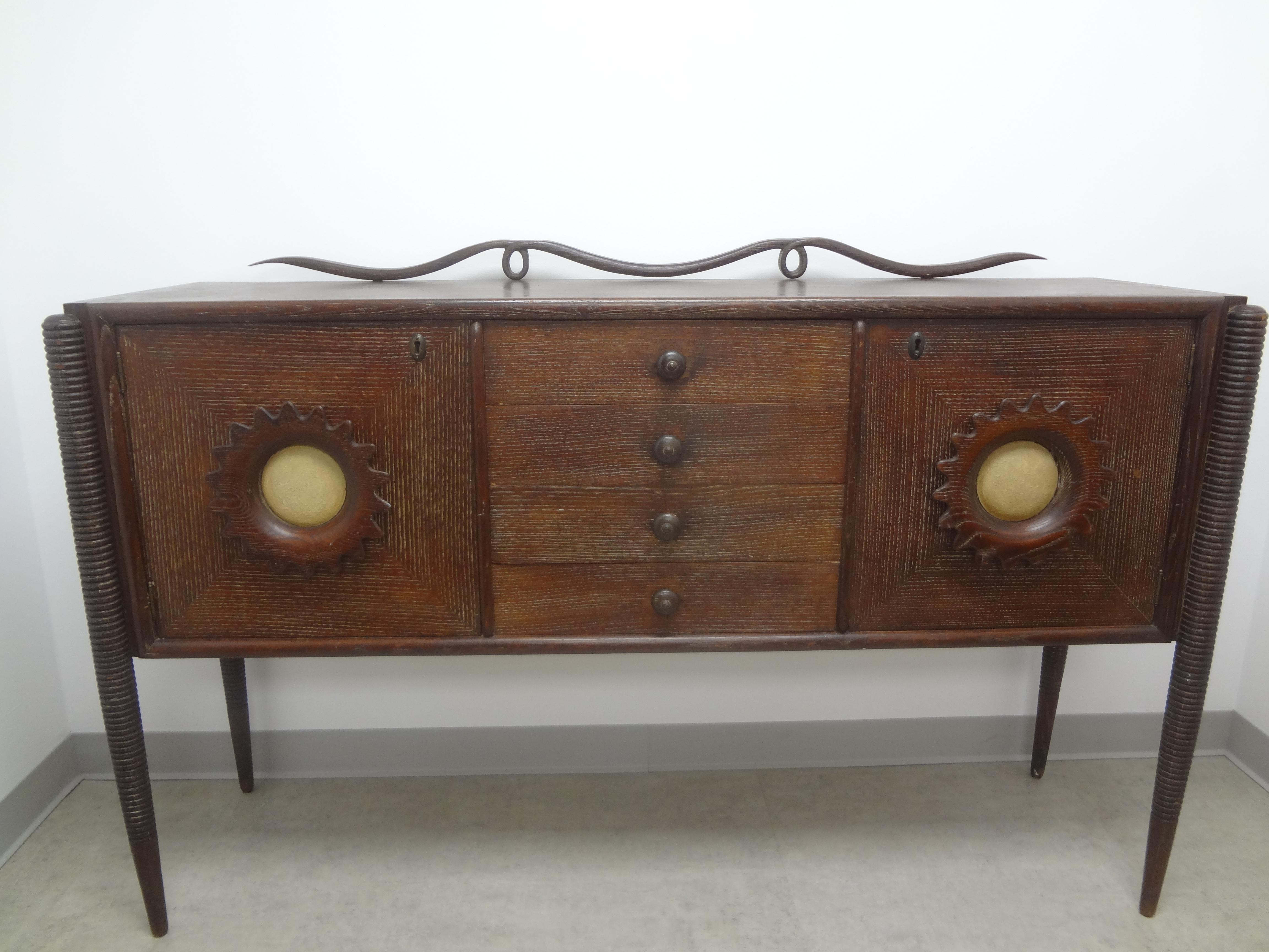 Italian Modern credenza attributed to Paolo Buffa. This stunning Italian Mid-Century organic Modern Cerused piece can be used as a credenza, console, sideboard, cabinet, bar or buffet and dates to the 1950s. This lovely Italian Mid-Century Modern
