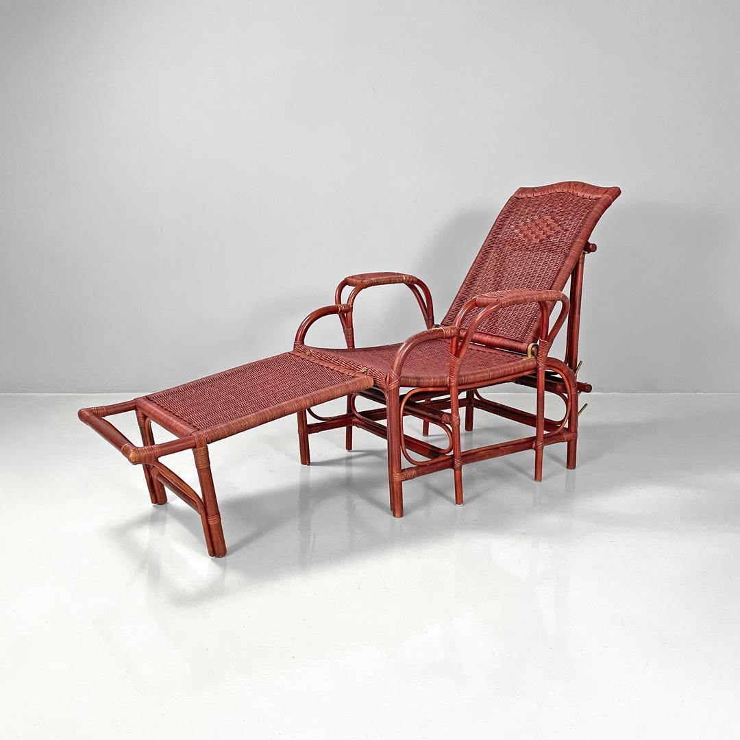 Italienischer moderner dunkelroter Rattansessel 981 mit Fußstütze von Bonacina, 1980er Jahre
Rattan-Sessel oder Liegestuhl mod. 981 mit Armlehnen und Fußstütze. Die Struktur ist dunkelrot lackiert, mit dekorativen Texturen auf der Rückenlehne und