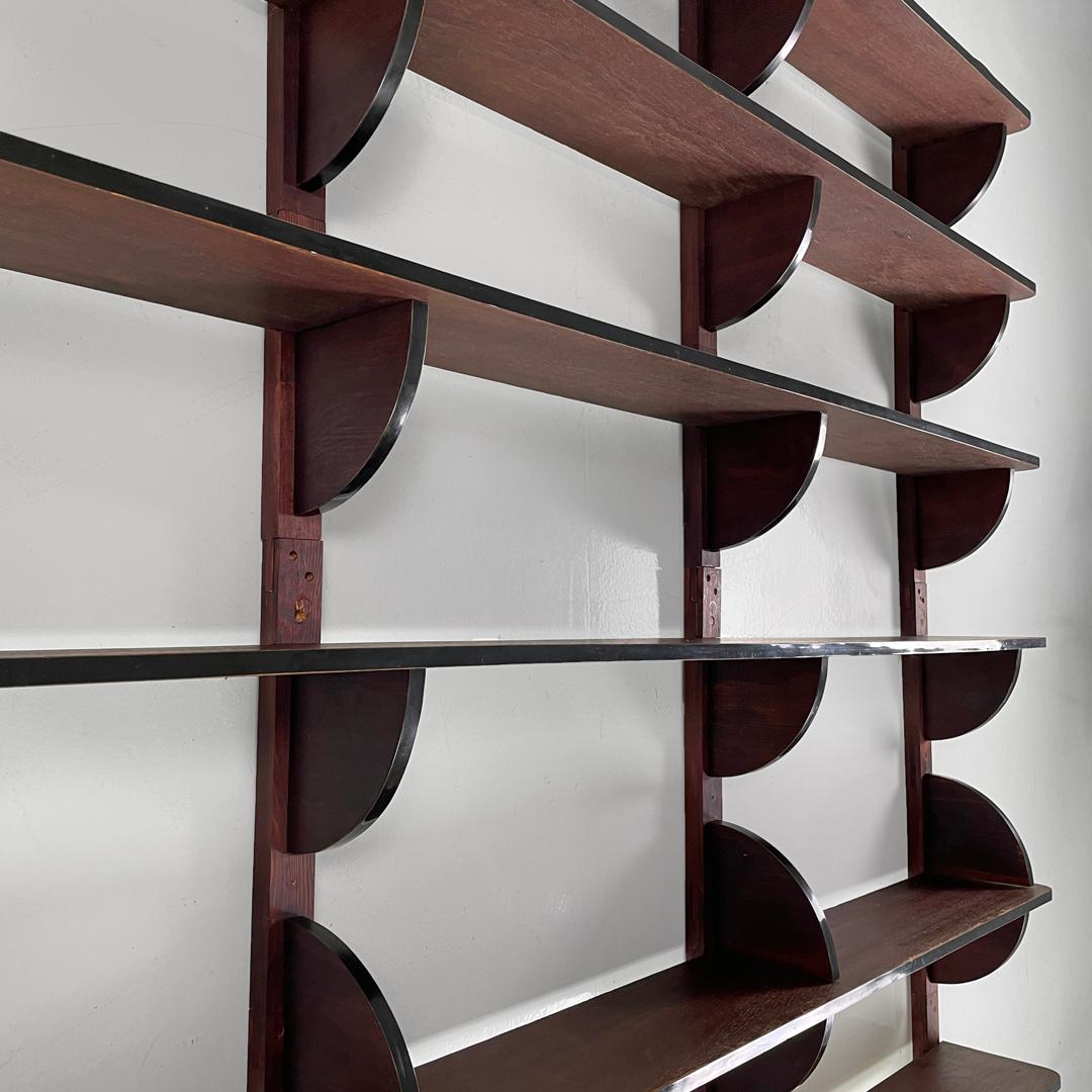 Italian modern dark wood wall bookcase with black plastic details, 1980s For Sale 1