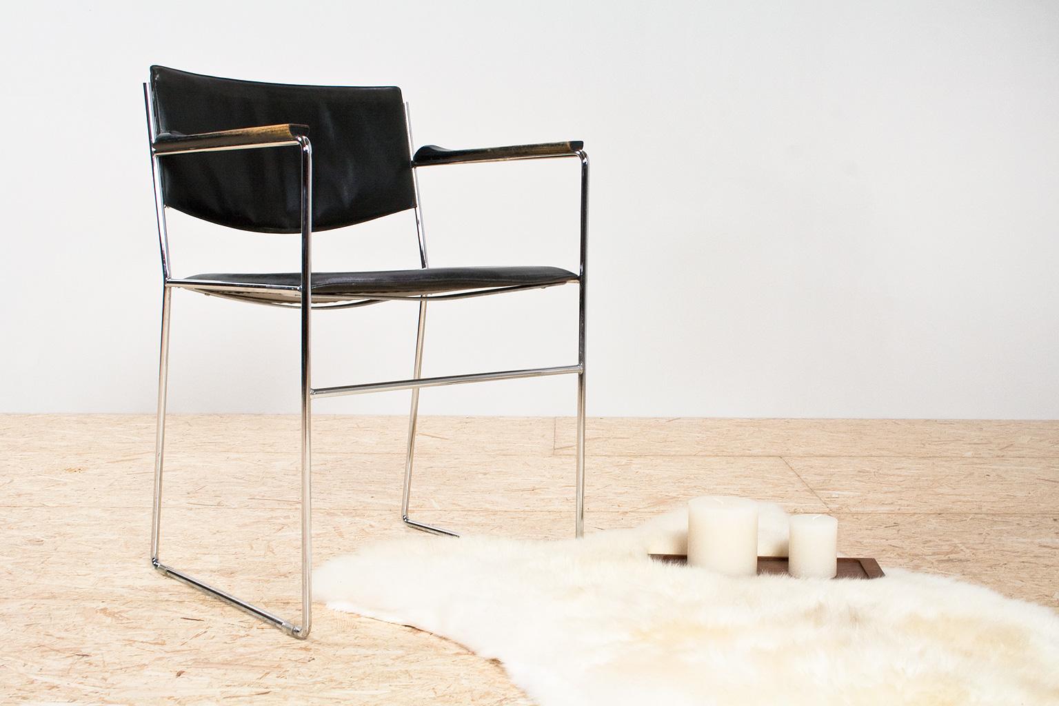 In style with the modernist designs of Marcel Breuer, Giovanni Carini, Mies Van Der Rohe, this is a beautiful and elegant chair. Elegant thin metal tubing is combined with luxury, thick leather seat and wooden armrest. The chair is in good vintage