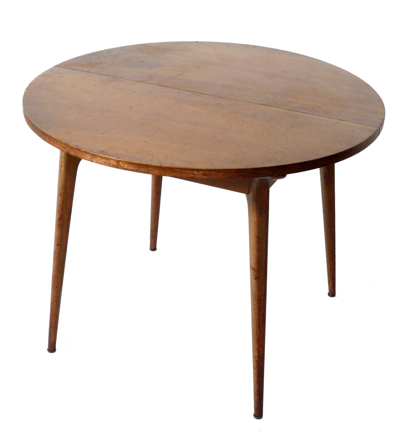 Italian modern dining table, designed by Bertha Schaefer for Singer and Sons, Italy, circa 1950s. This table is currently being refinished and can be completed in your choice of color. The price noted includes refinishing. Schaefer designed this