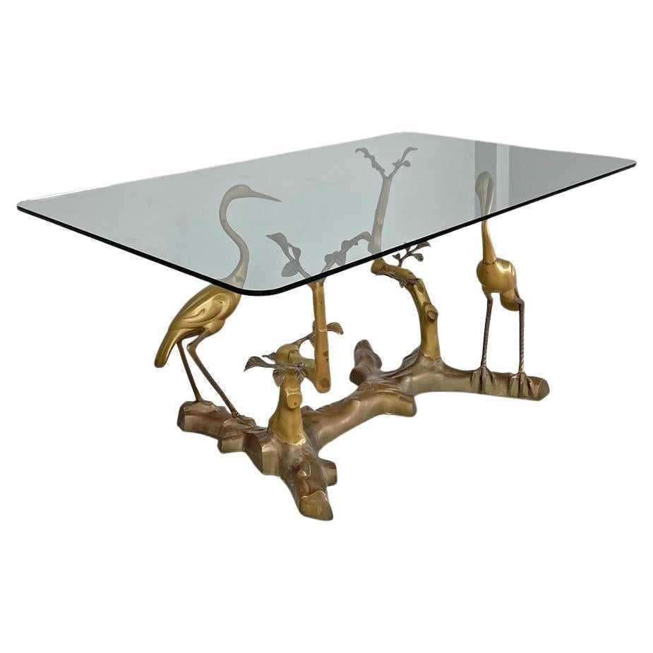 Italian modern dining table with sculpted and decorated brass structure, 1970s For Sale